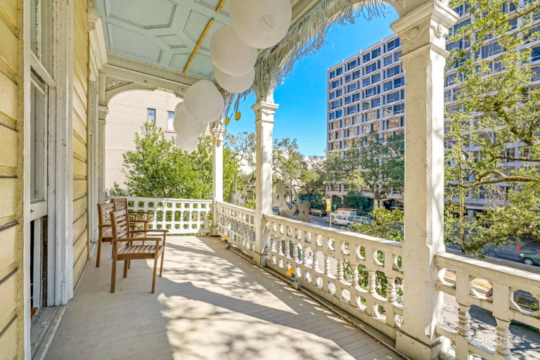  second floor porch overlooks historic Saint Charles Avenue 