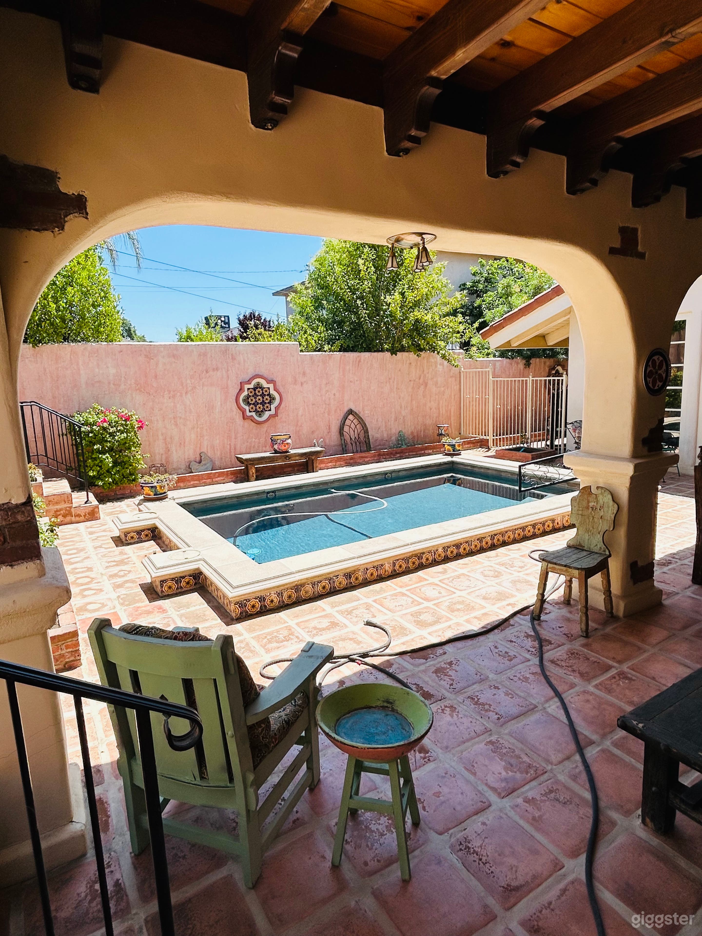 SIDE VIEW SHOWING ONE OF SEVERAL TALAVERA TILE MEDALLIONS ON THE EXTERIOR WALLS.