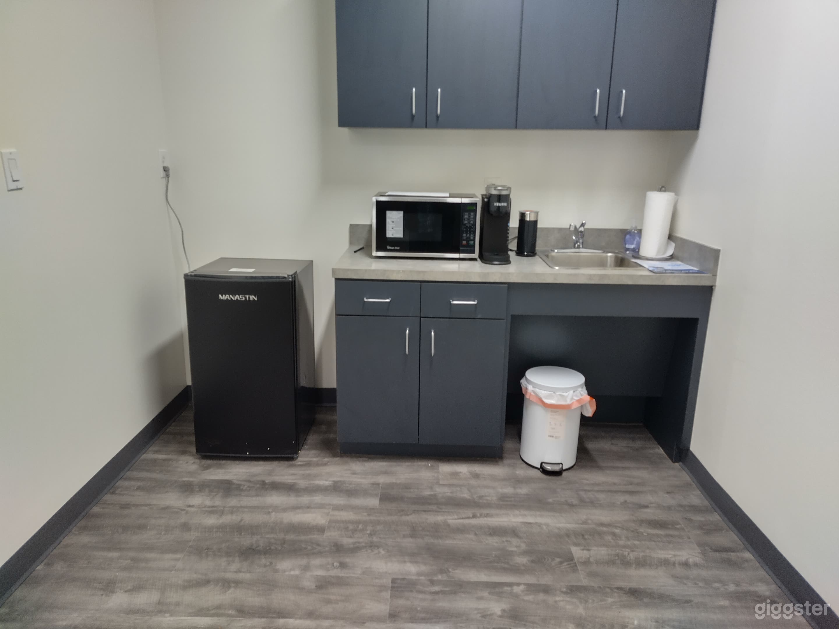 Full kitchen in other suite features a dinette set and couch as well..
