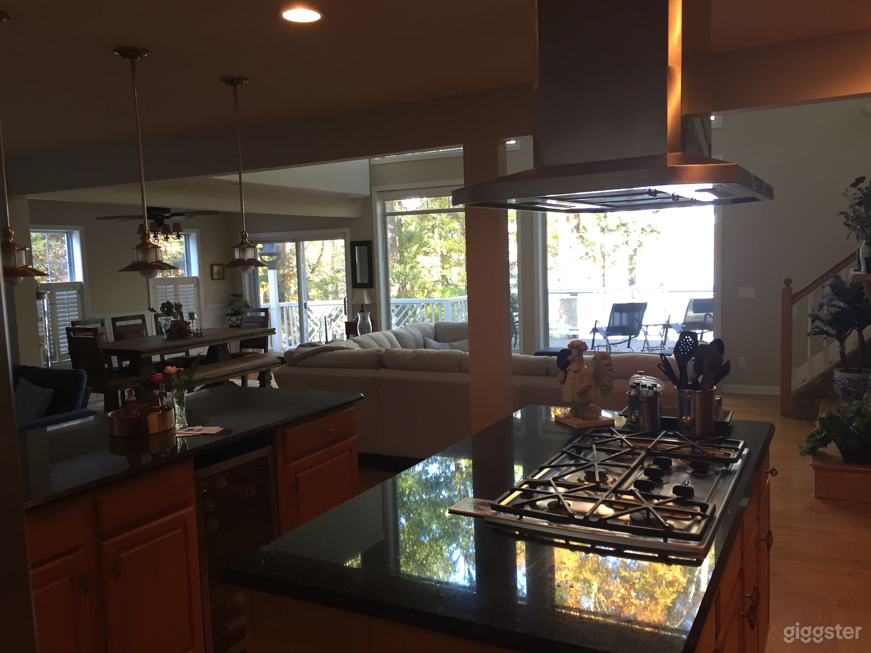View from the kitchen through the great room overlooking the lake from the main floor. 