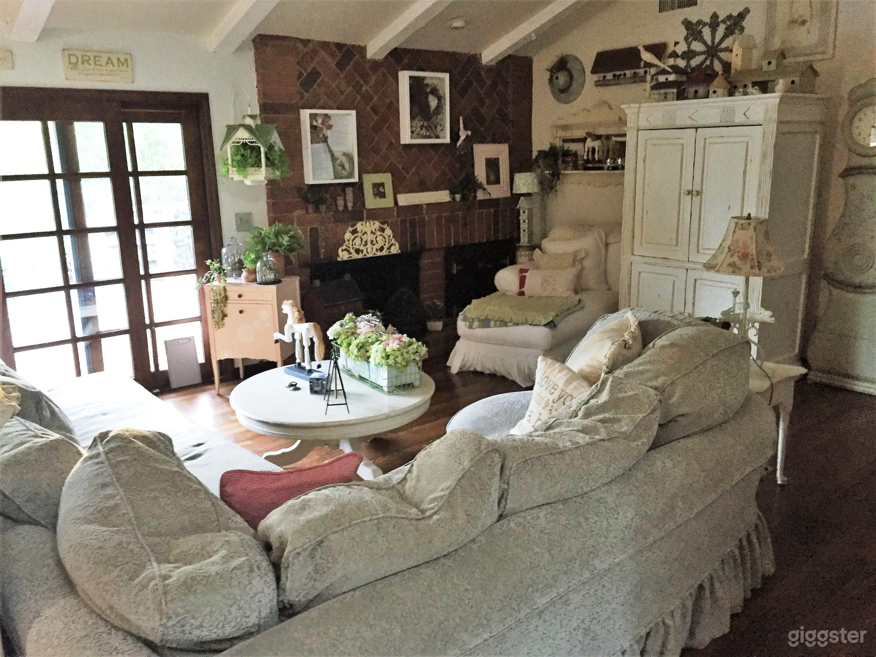 The den, lookinjg out at back porch and back yard