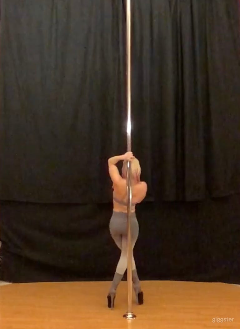  Black curtain set up behind a pole 