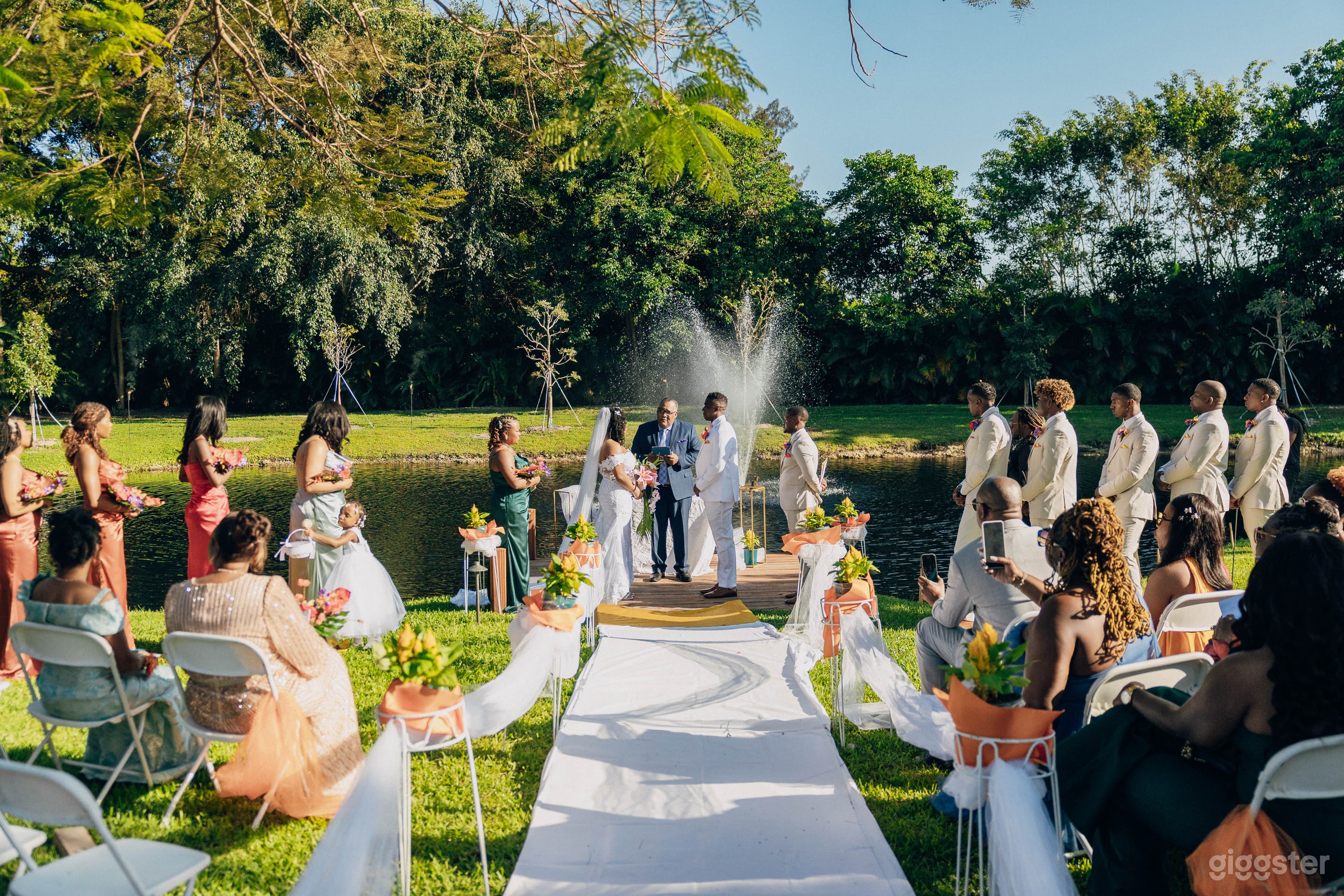 Lakeside Wedding Ceremony with Romantic Fountain Backdrop