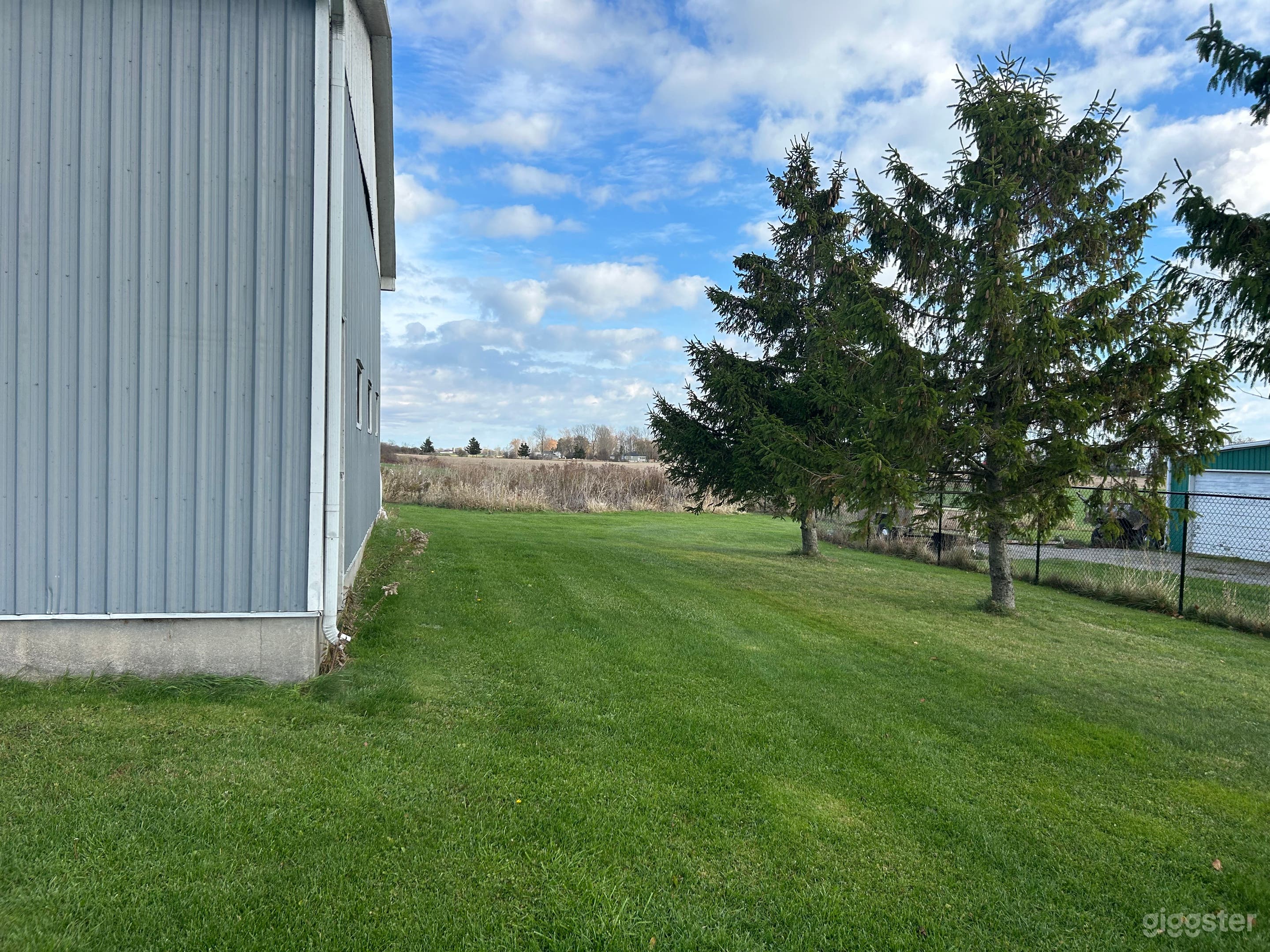 Country Backyard with Scenic Fields Photo 3