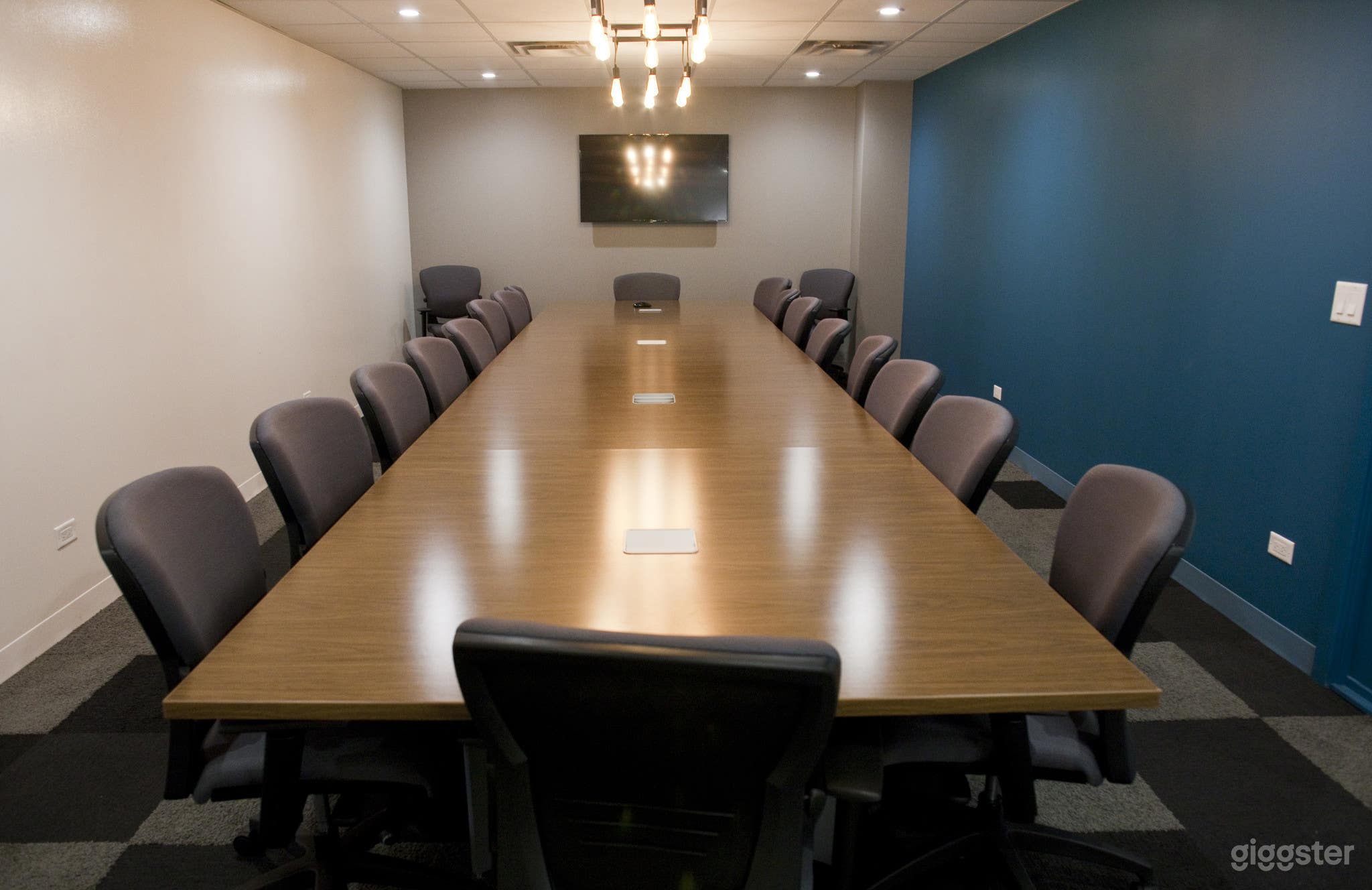 Board room table with plug in capabilities, LED presentation monitor, and other AV services, brainstorming wall. Seats 20 at the table.  