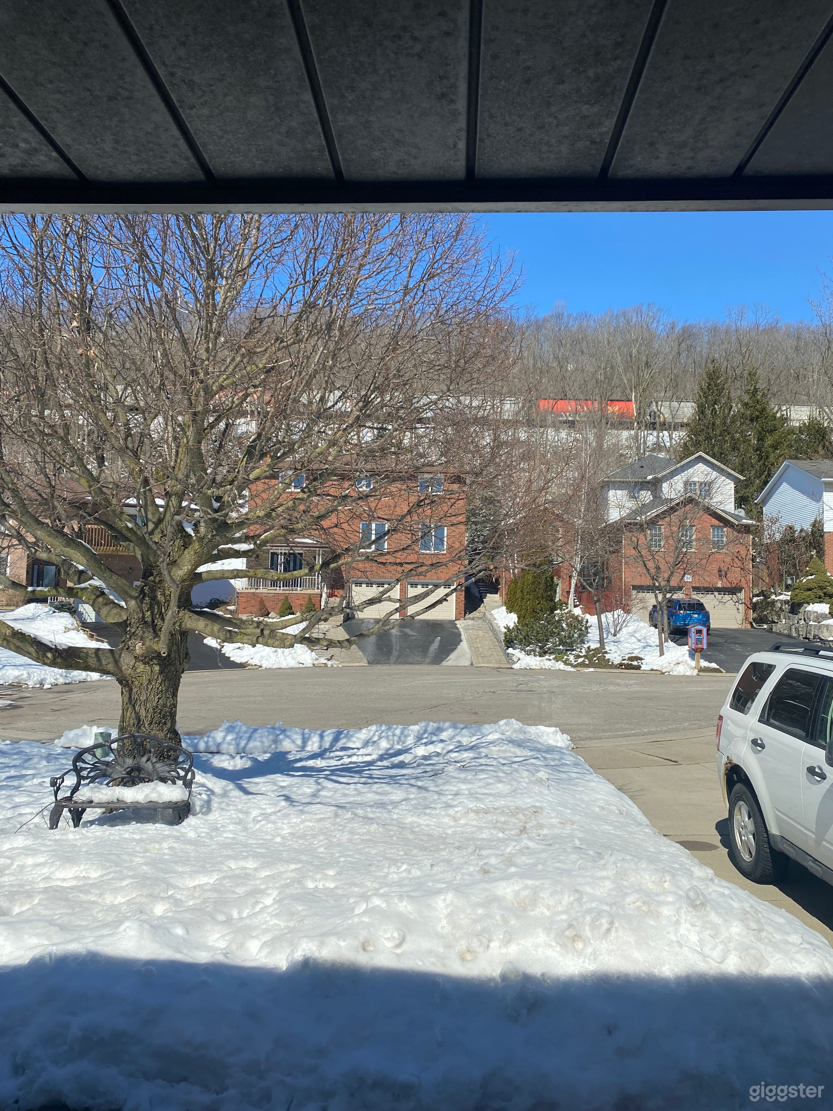 Front window view looking at train going by on escarpment