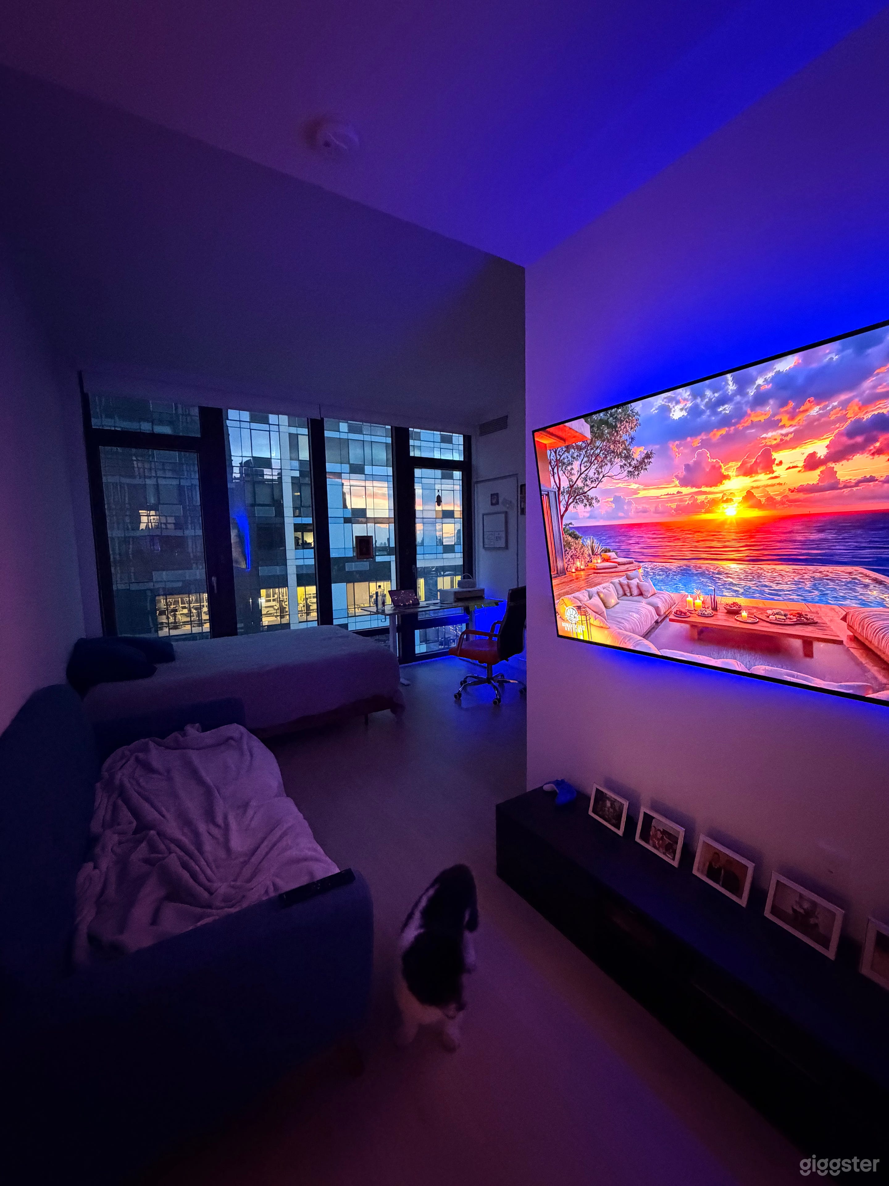 Spacious studio with a desk, couch, TV, and scenic views. Includes a Samsung Smart TV with Netflix, YouTube, live TV, HDMI, screen mirroring, and Apple AirPlay for seamless presentations and media playback.
