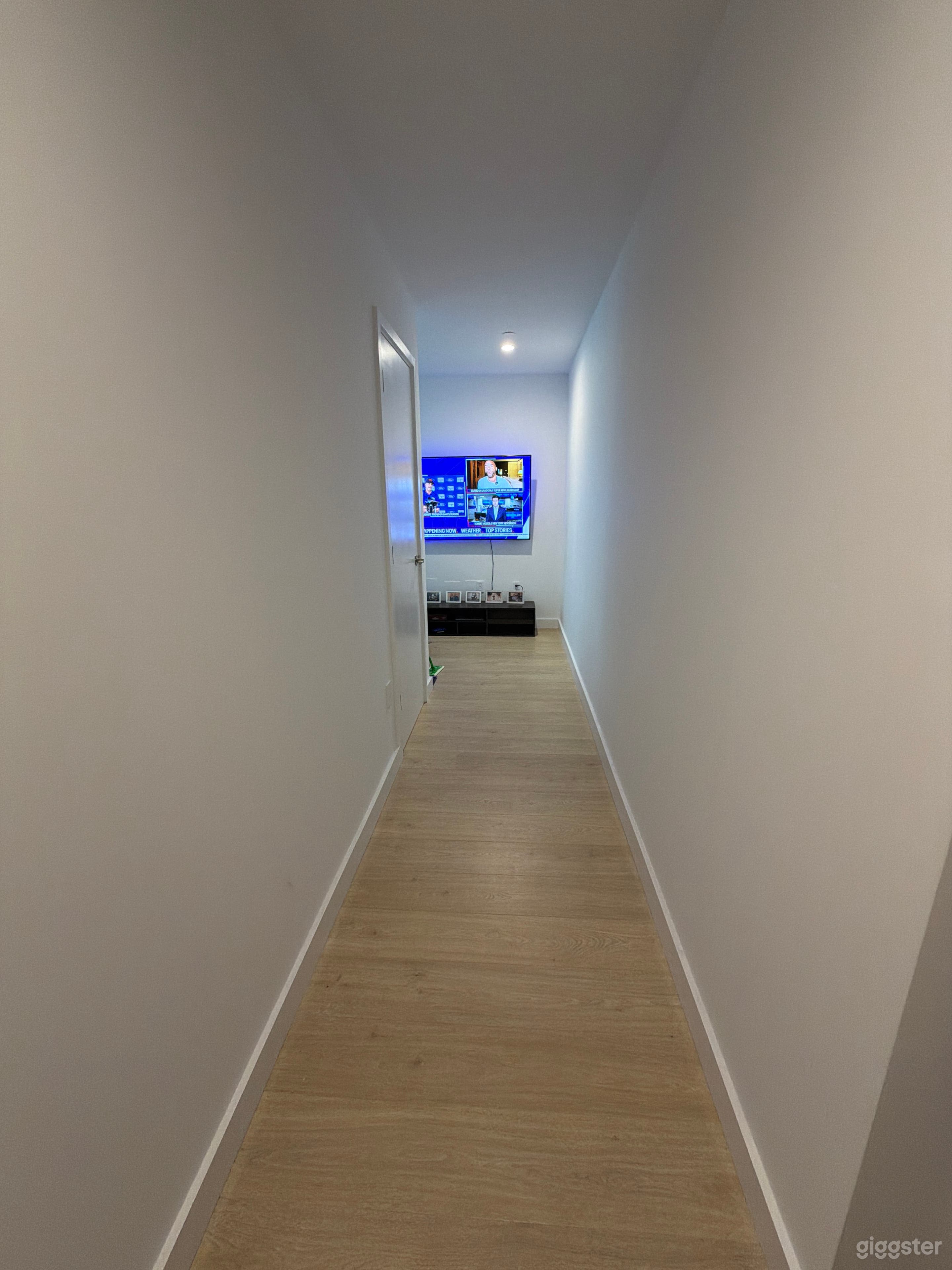 Spacious entry hallway with an open layout, offering a clean and functional space. Includes a washer and dryer conveniently located in a dedicated closet.