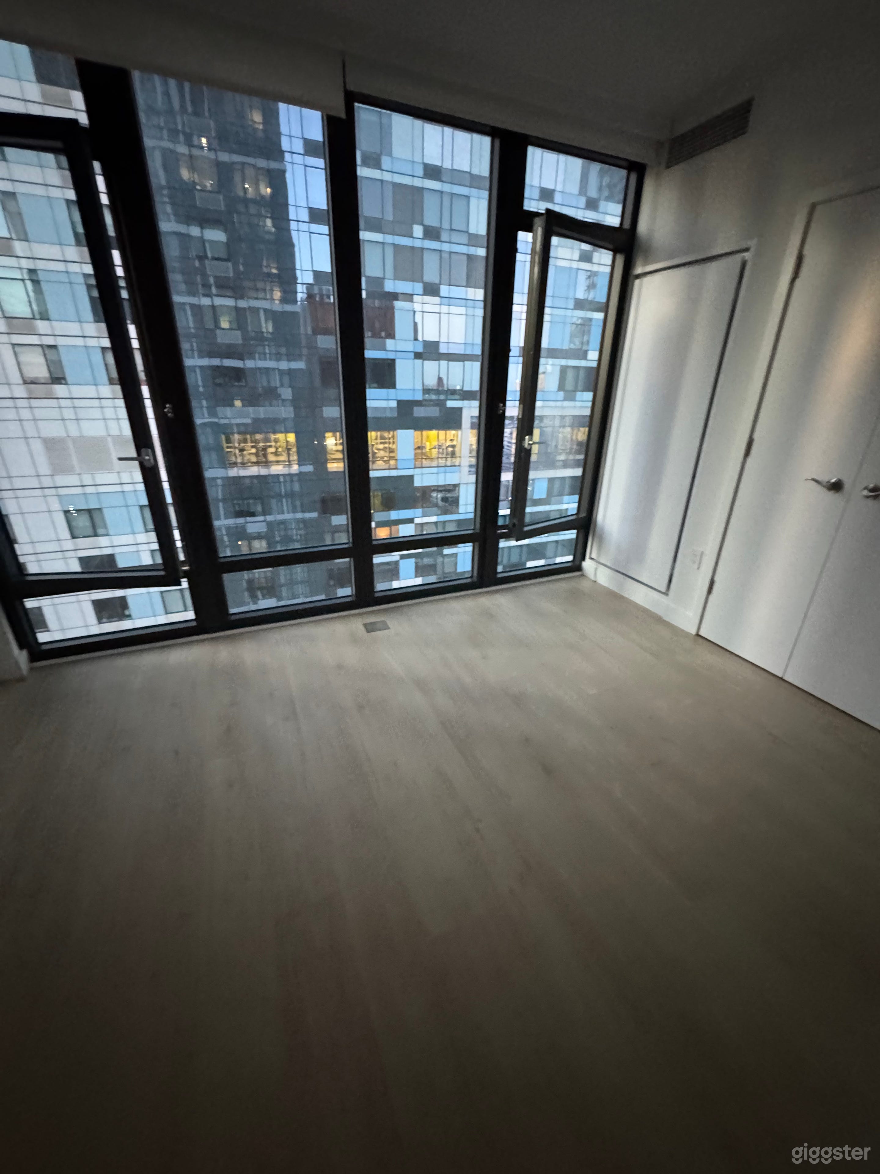Versatile open studio designed for photo and video productions. The flexible layout allows the bed, table, and couch to be easily moved, creating a spacious open set for any creative project.