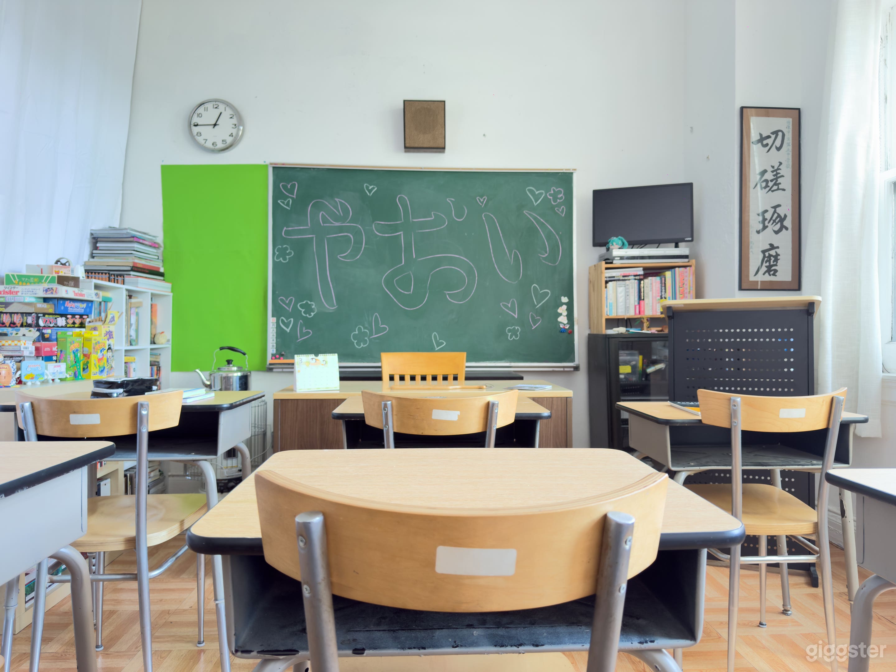 Classroom - 15'lx12'w. Windows along the right give lots of natural light in the daytime, and curtains on the left and back allow nearly 360 degrees of video / VR options. Opening in rear-left corner can be closed with shoji screen.
