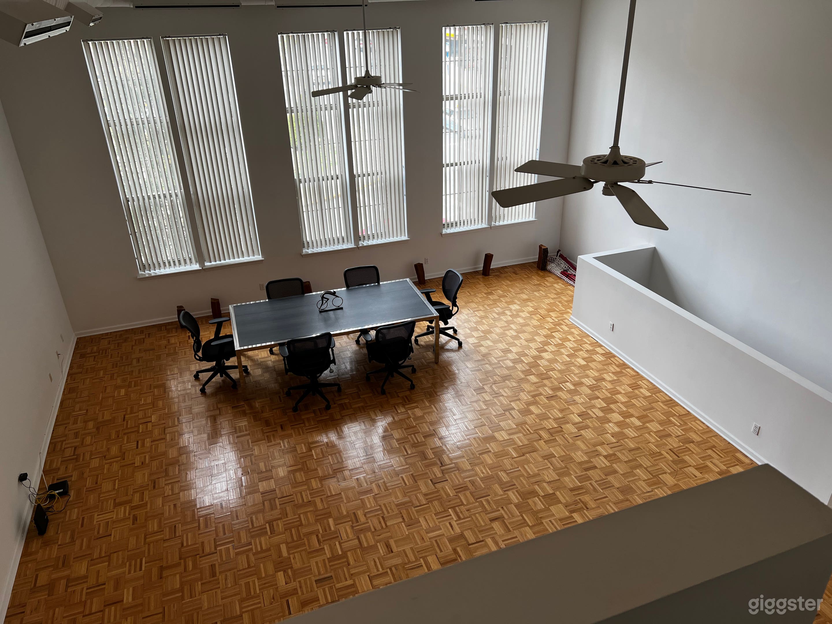 Main Loft Area, 18 foot high ceilings, 11 foot tall windows. Conference Table.