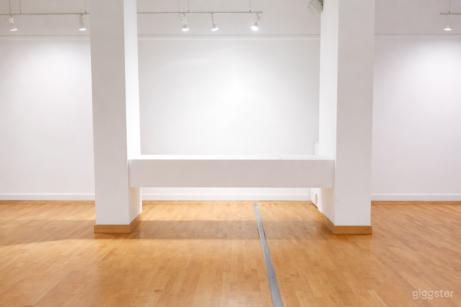 Art Gallery with White Walls and High Ceilings Photo 1