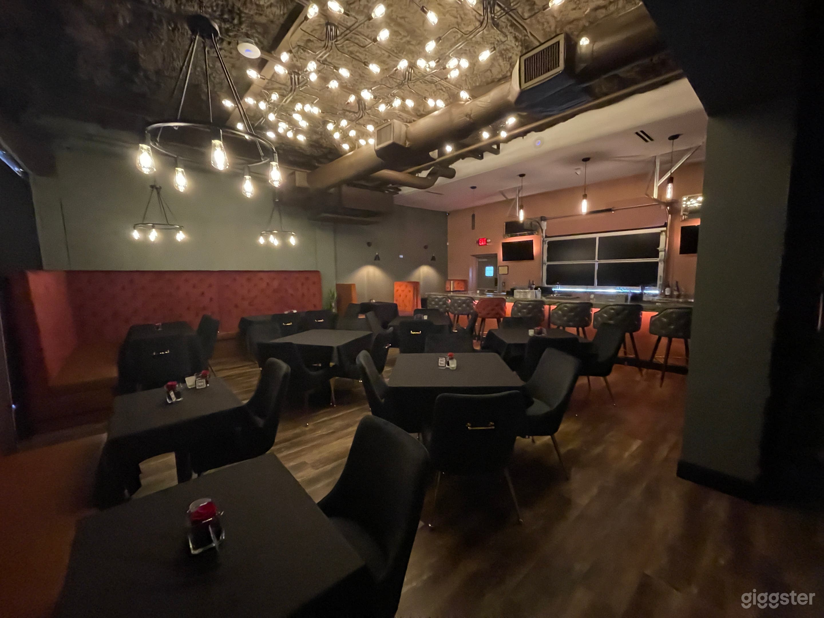 Dining Room with Bar and  Rollup Door to Outdoor Patio