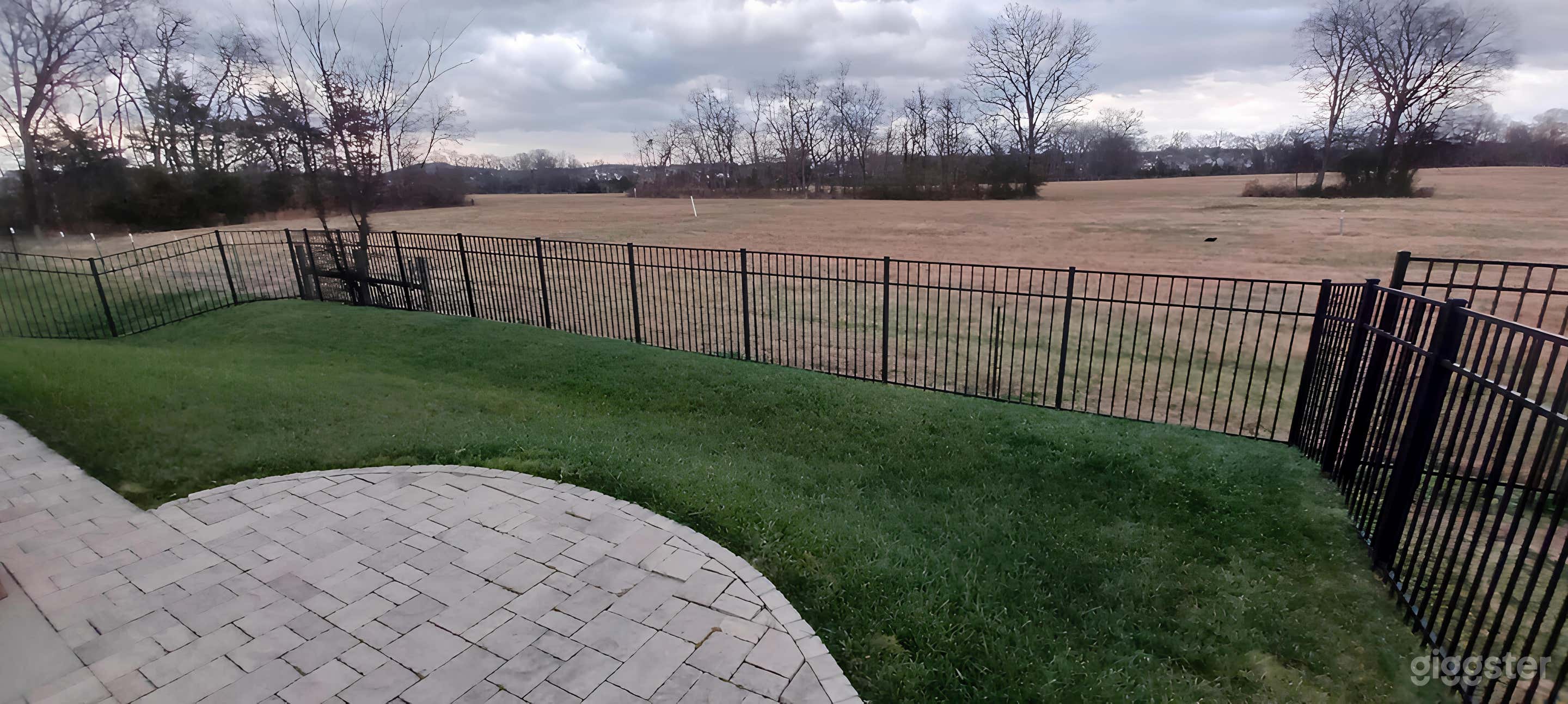 Modern Backyard with Scenic Backdrop Photo 3