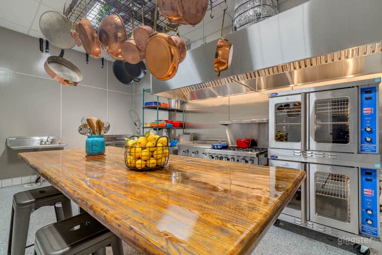  Commercial kitchen with adjustable counter / table 