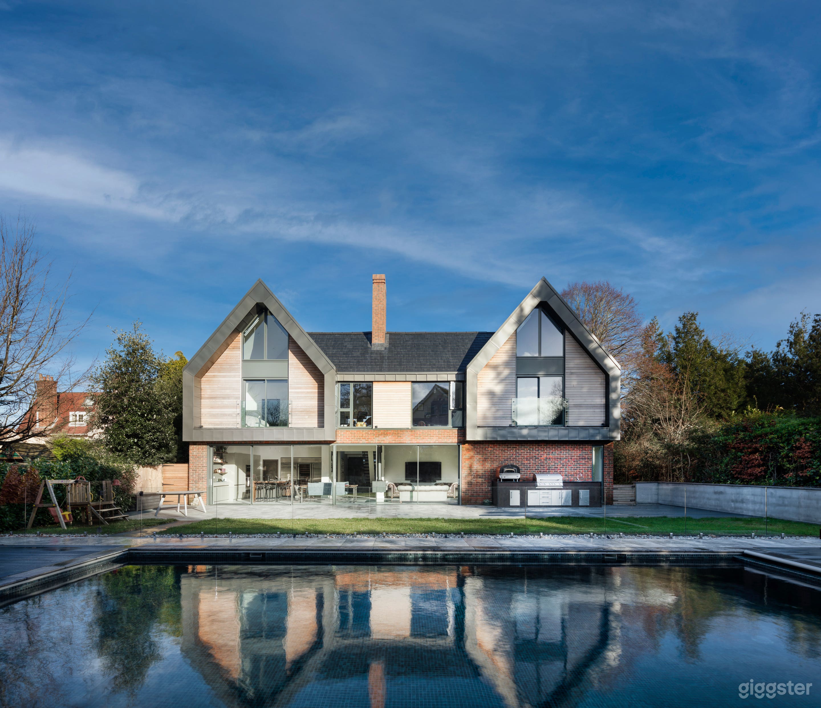 Modern Glass House with Pool Photo 1