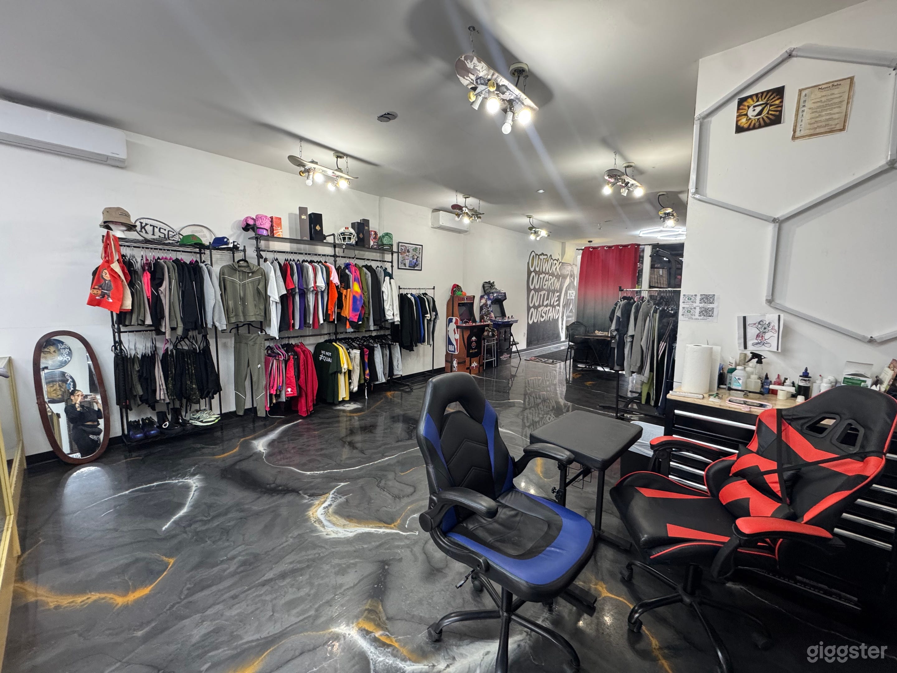 Spacious open-layout studio with polished floors, custom lighting, and flexible creative zones.