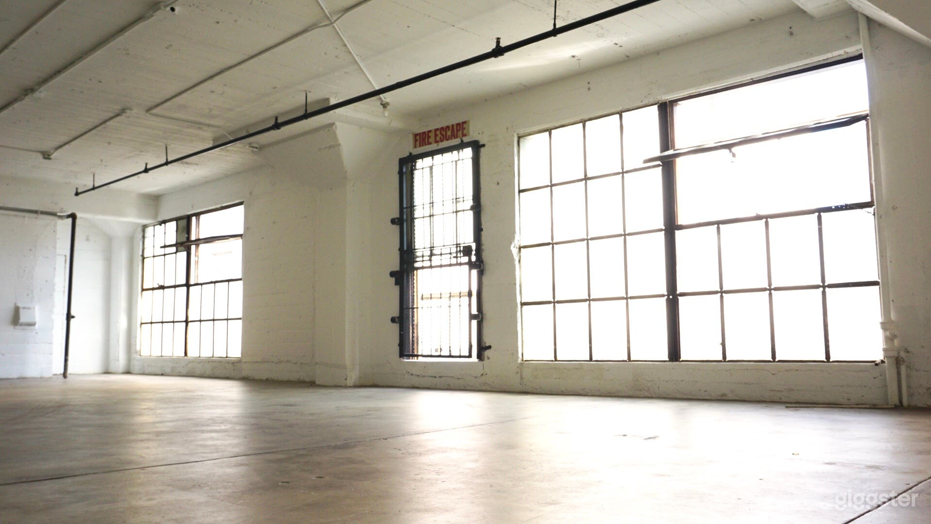 Downtown Studio Loft  Concrete and White Wall  Photo 4