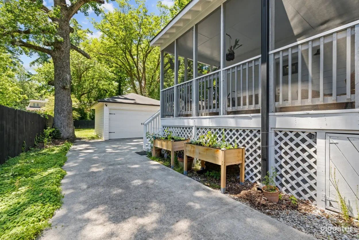 Quiet Green Backyard with Deck and Trees Photo 3