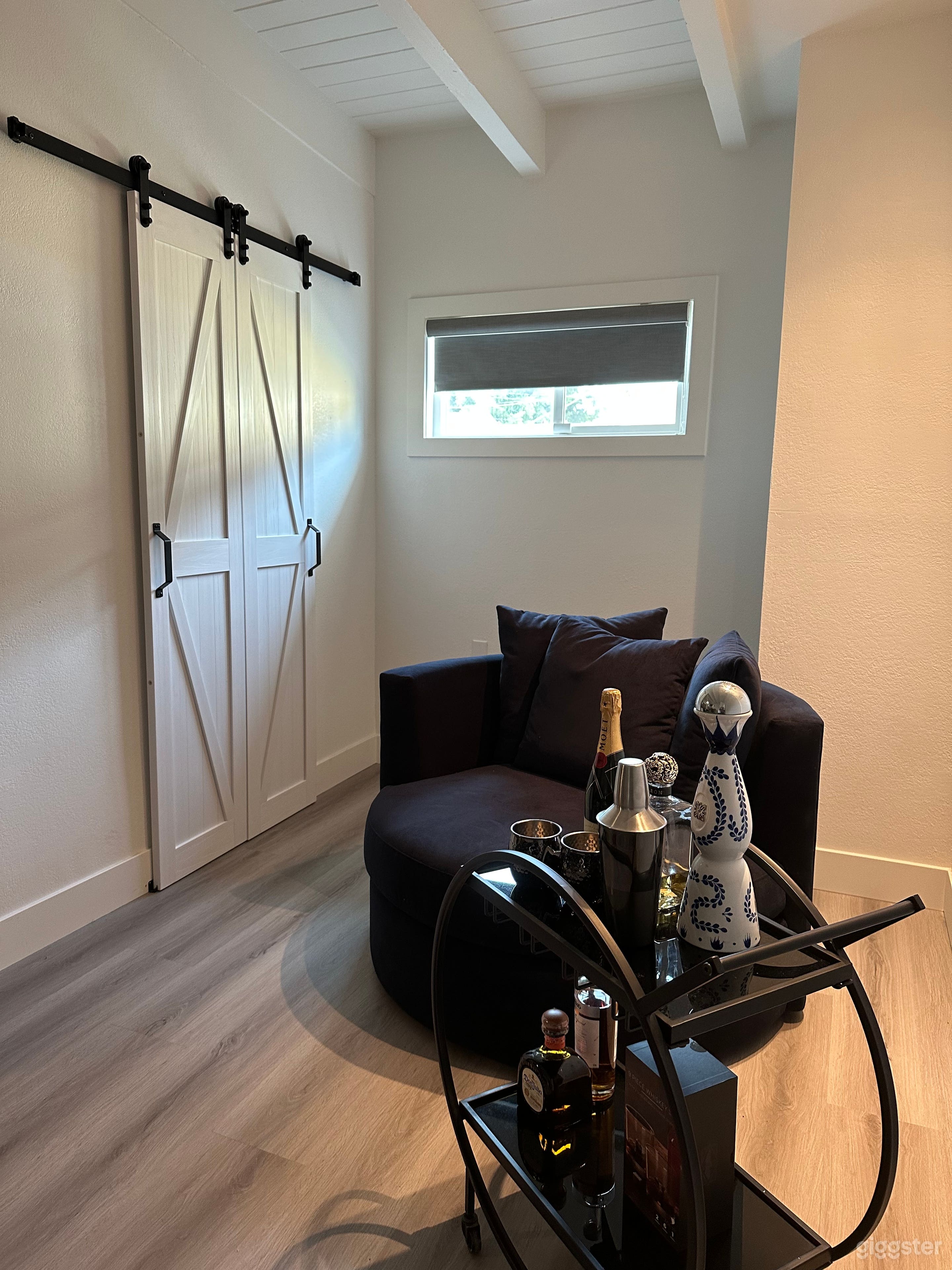 Master bedroom sitting area and rolling bar