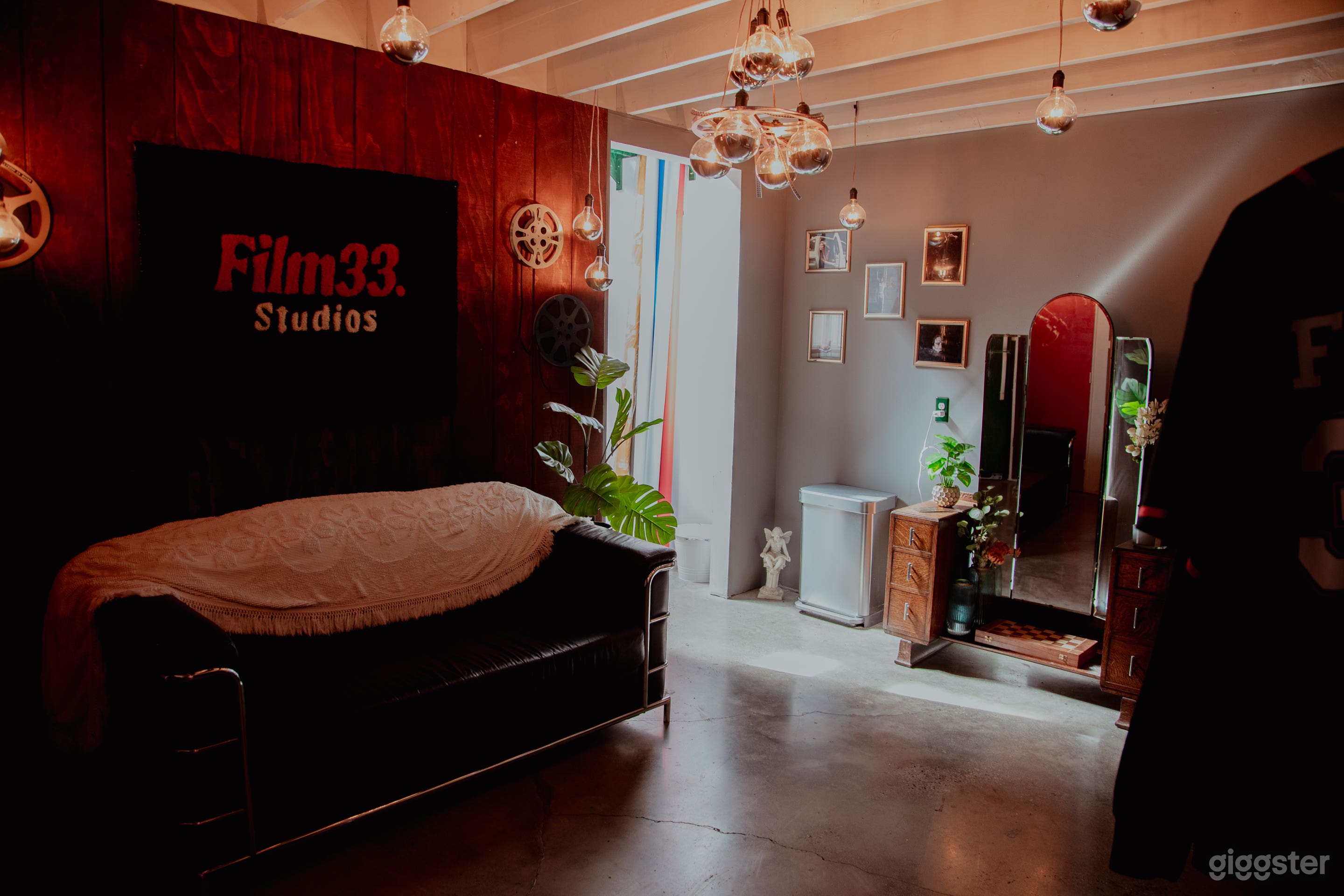 green room with makeup mirror and lounge area