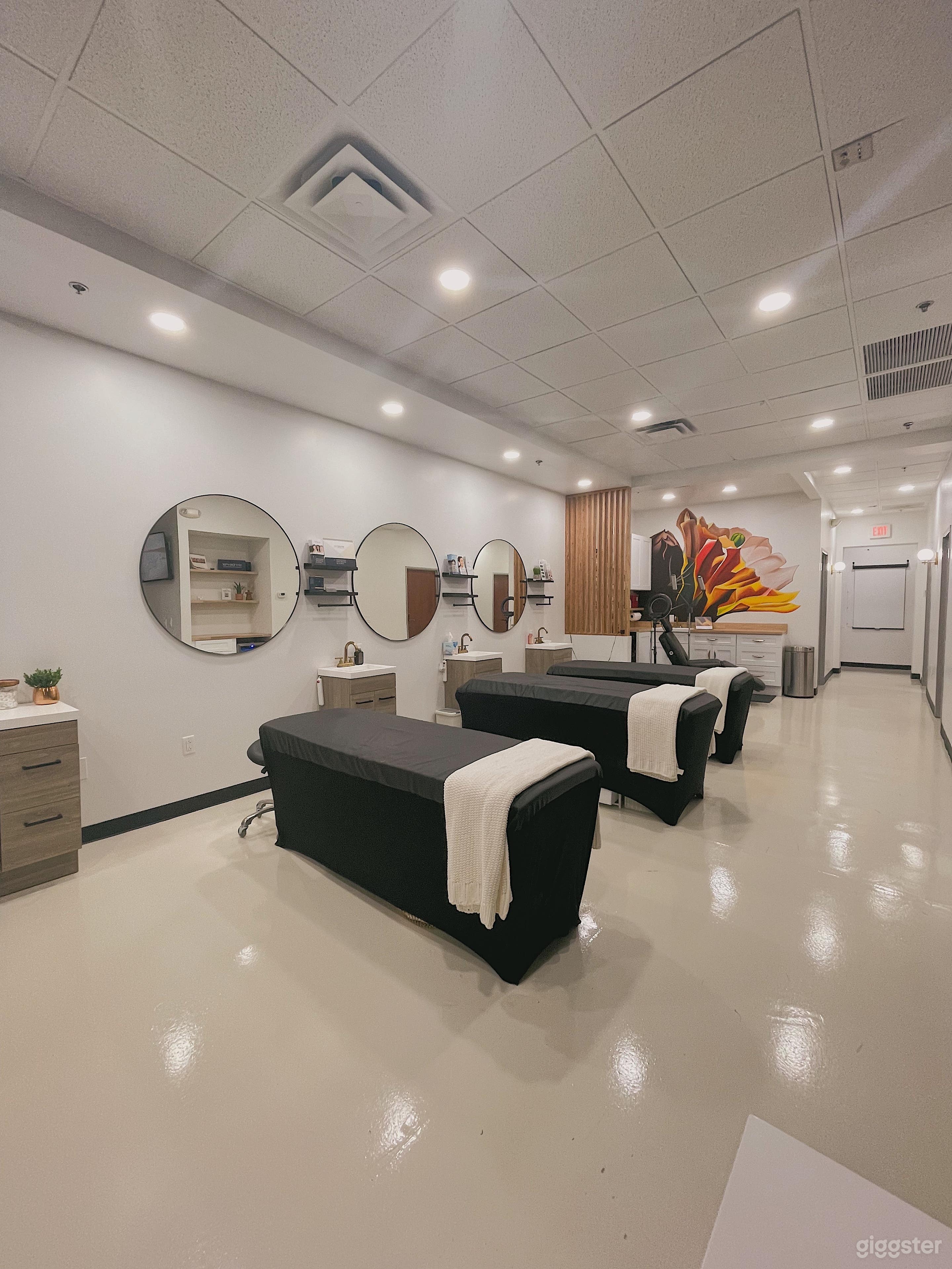 Three work stations with Massage tables and sinks