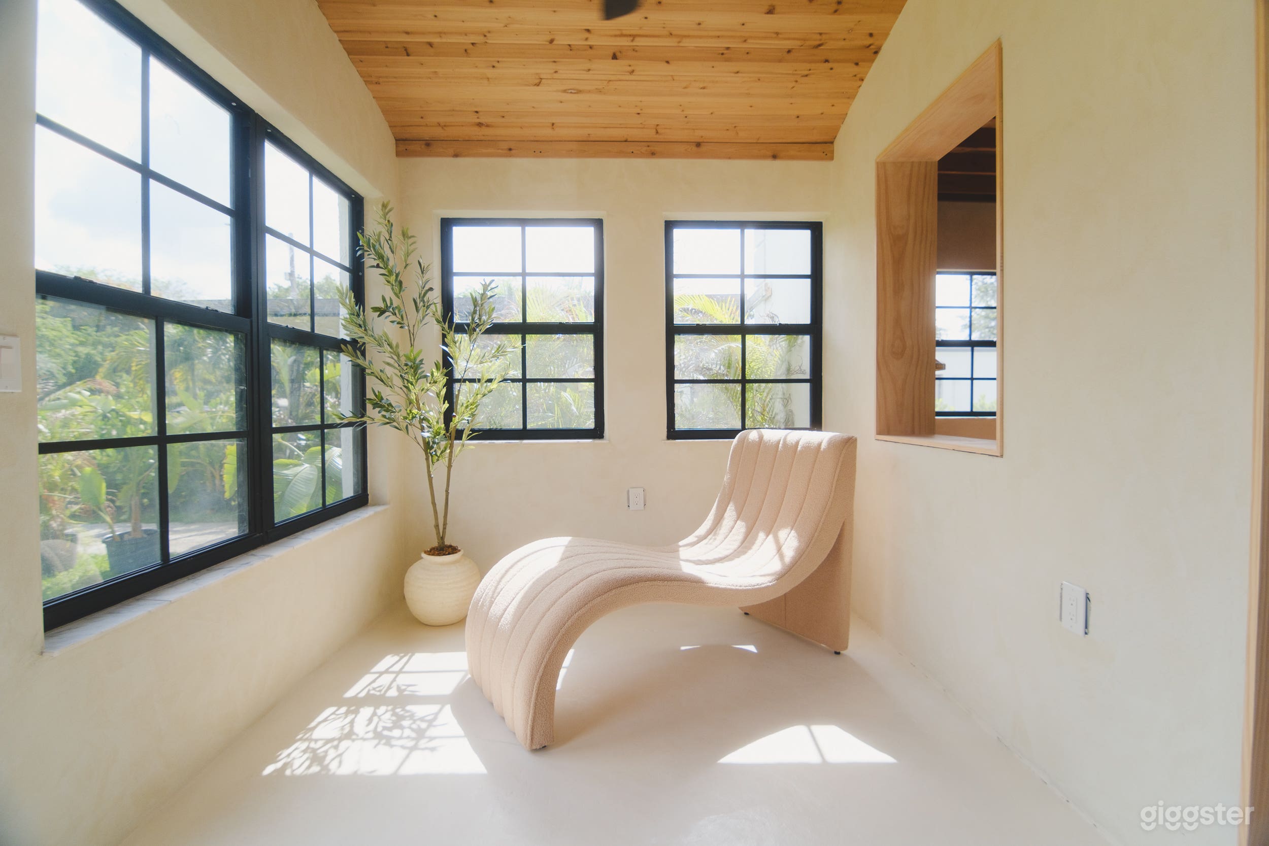 A sun-drenched home with lime-wash walls & vaulted ceilings. Photo 1