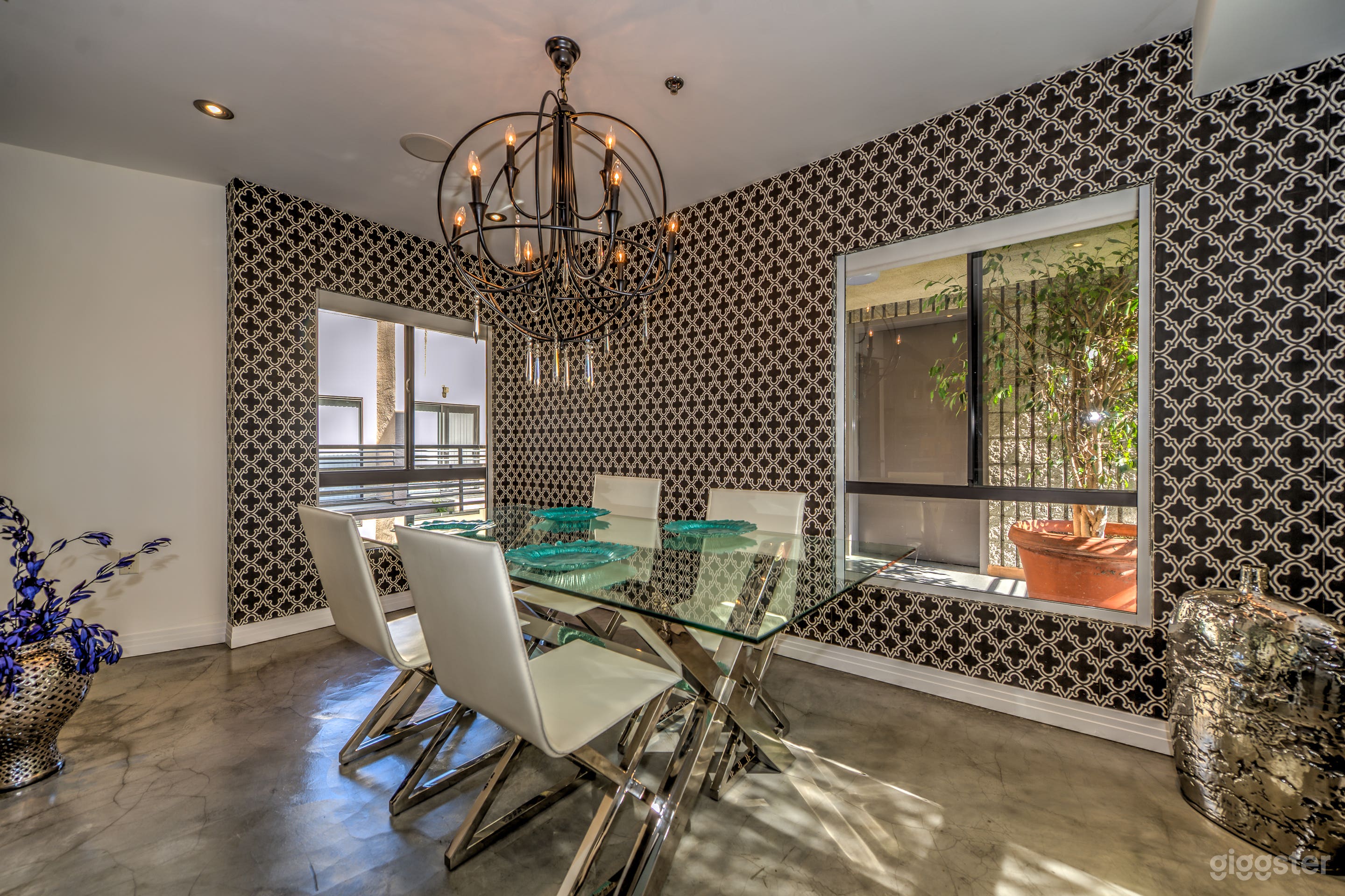 Dining room with designer chandelier and furnishings