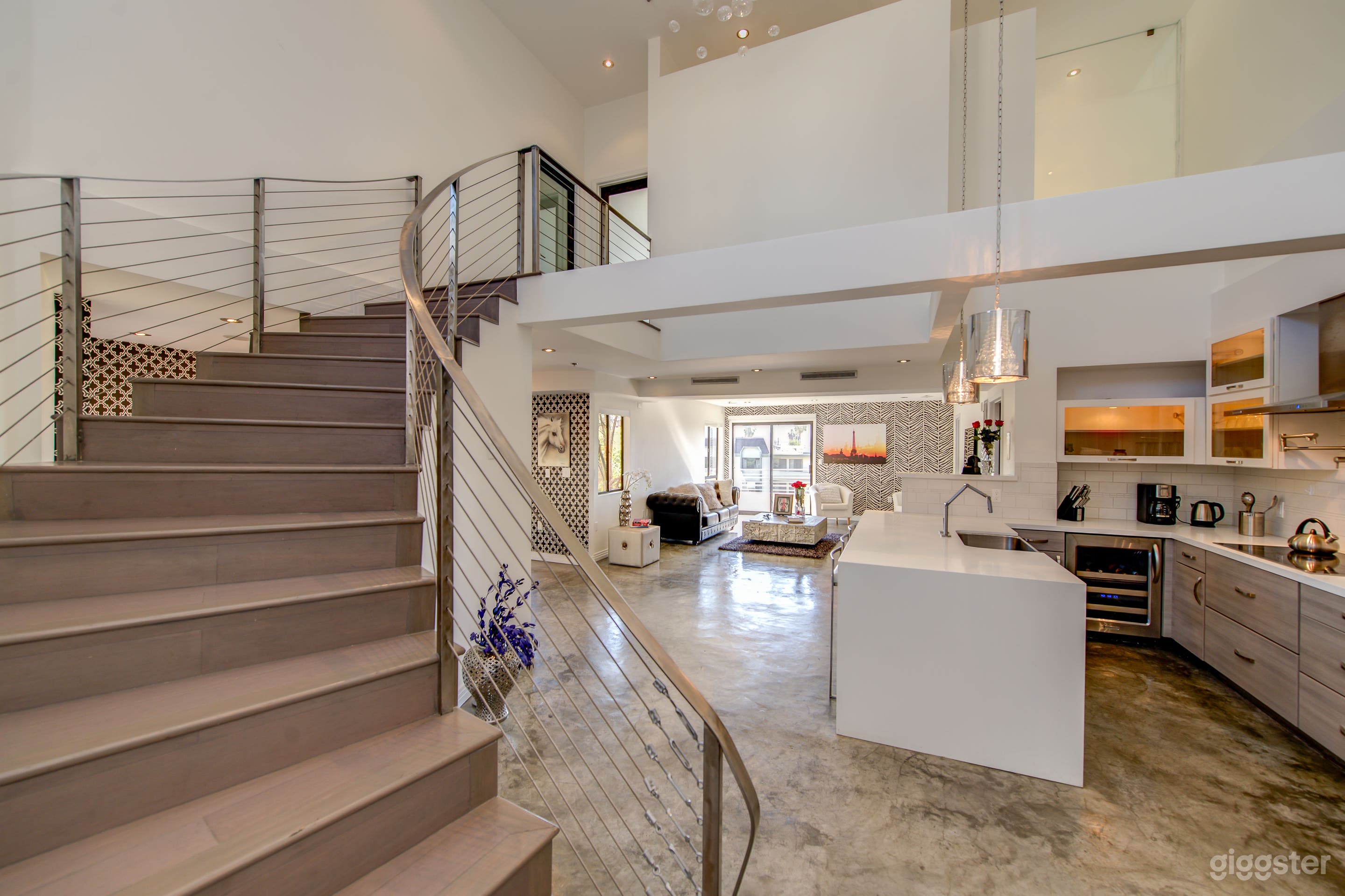 BRIGHT open entryway with 20' high loft ceilings
