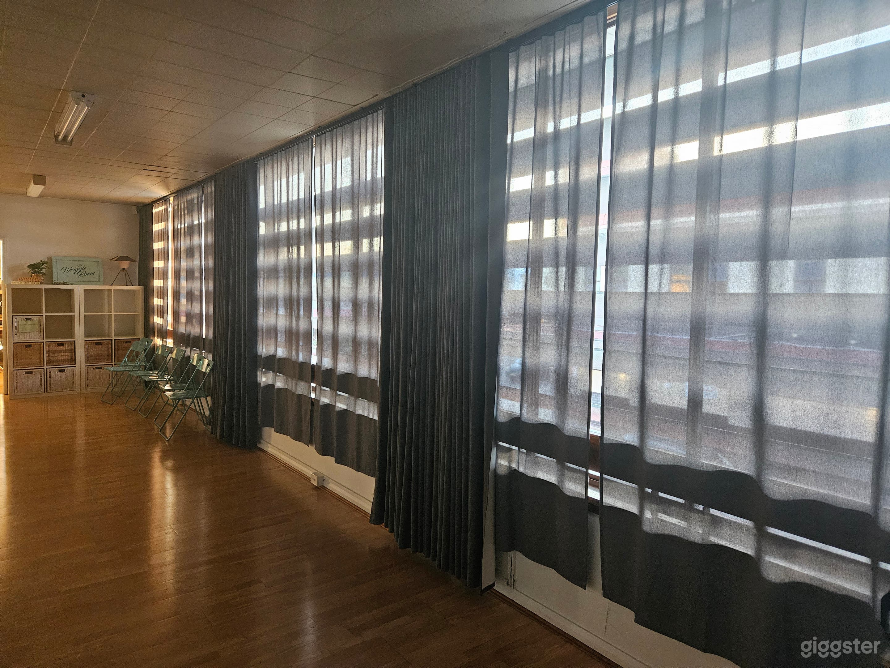 Run of windows with block out curtains open