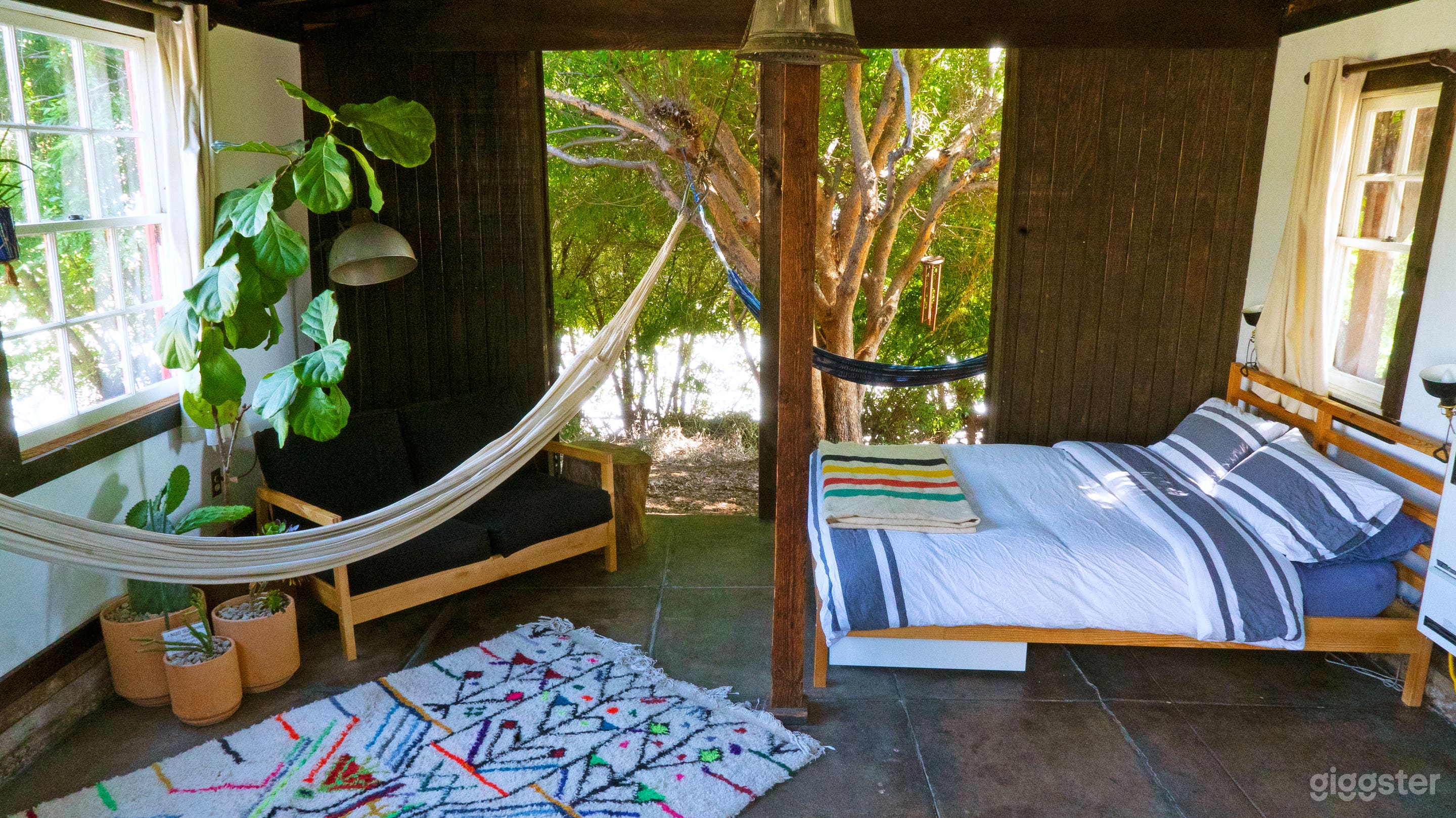 The barn interior with the barn doors open.