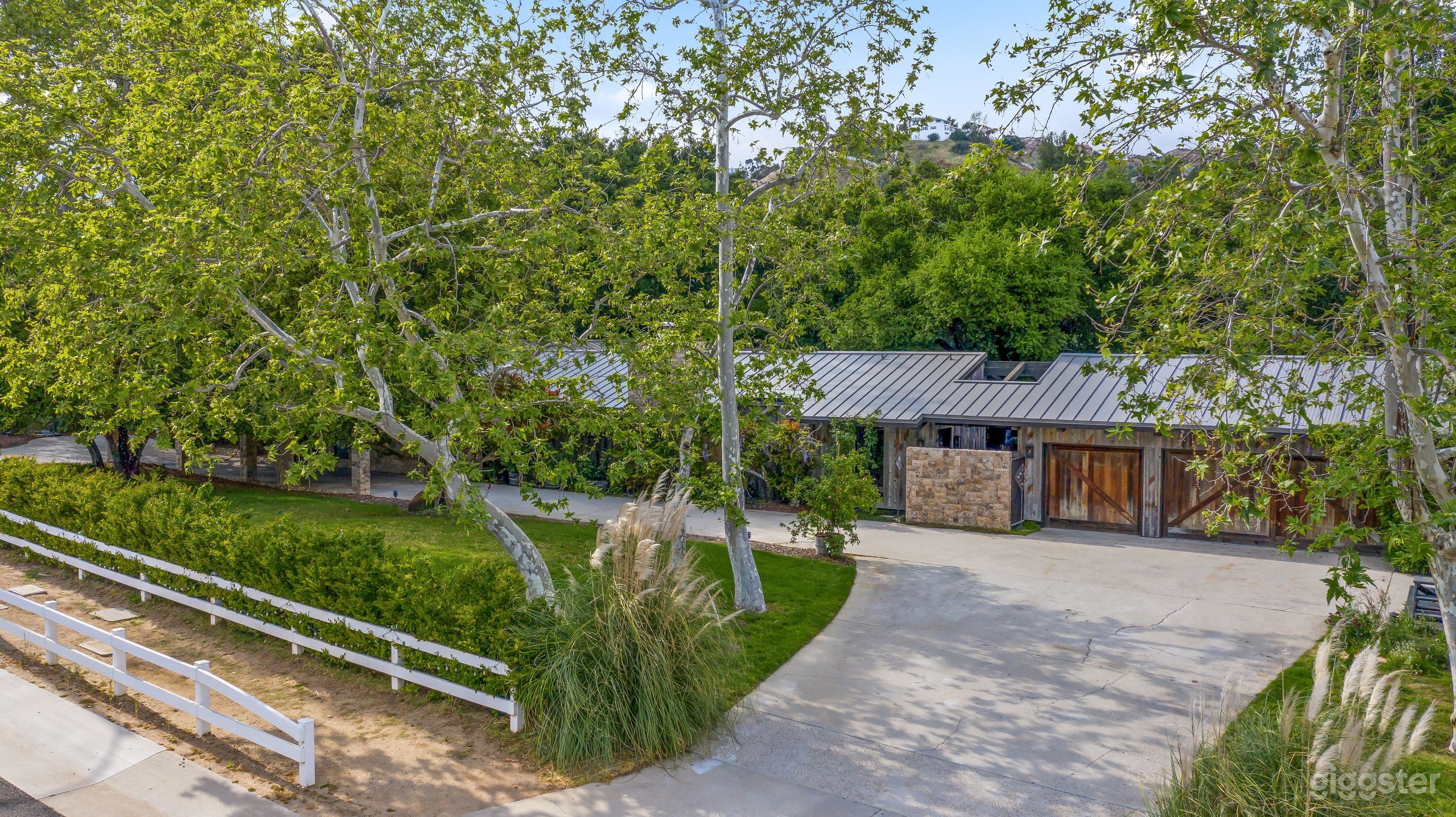 Front of house and wraparound driveway