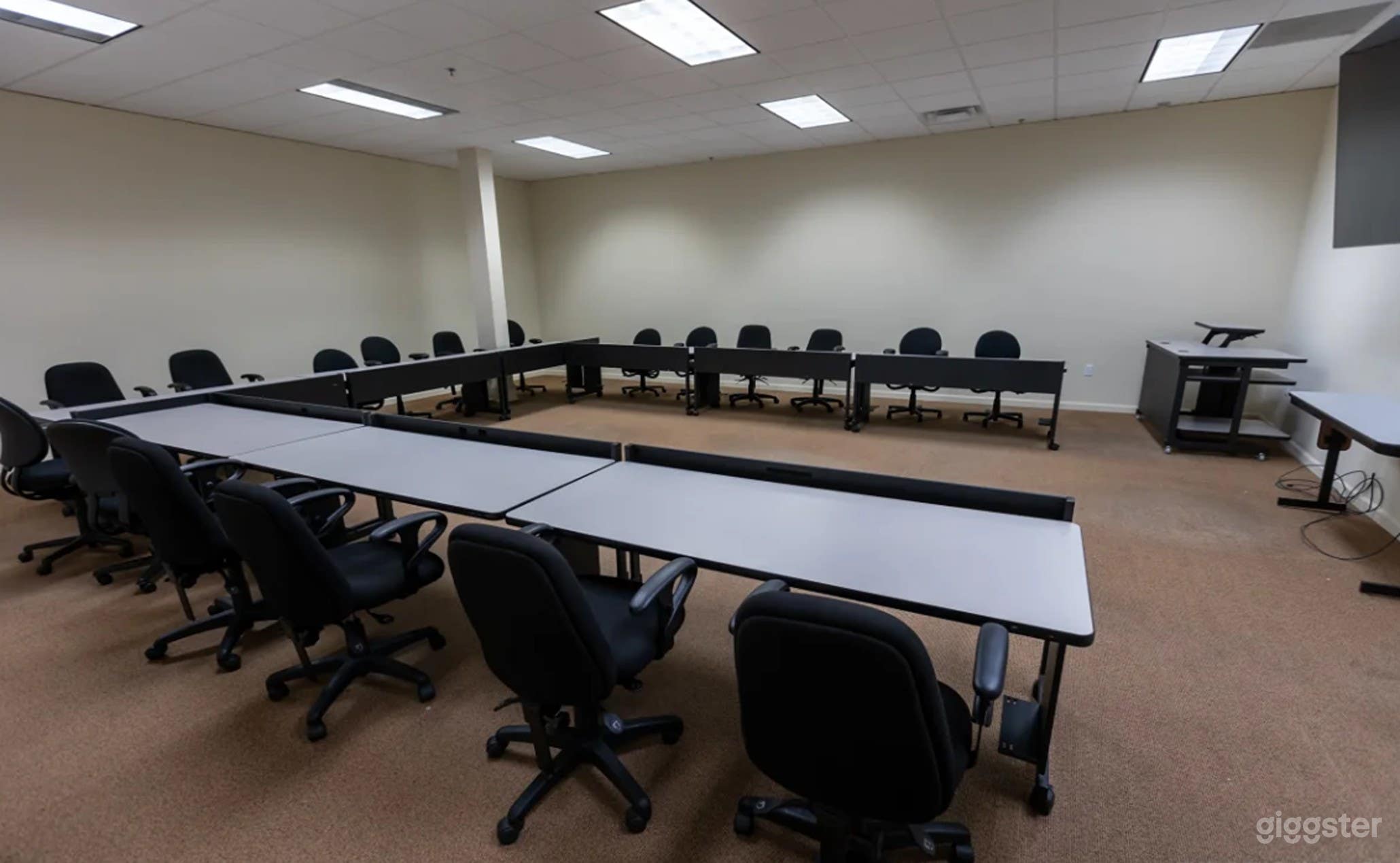Spacious Meeting Room with Large TV and Whiteboard Photo 3