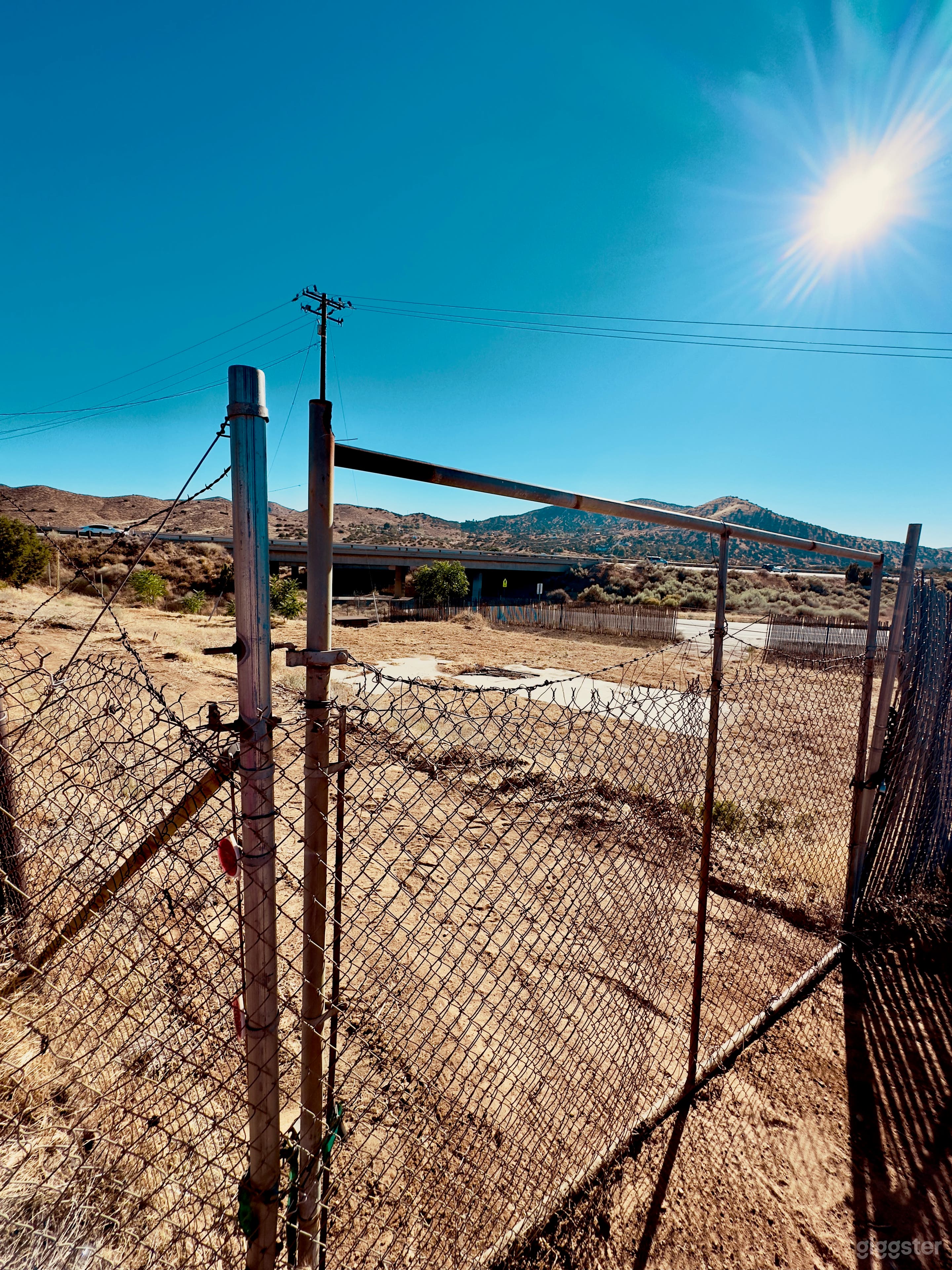 View from our upper property and the second gate looking southwest  with desert views of a commercial lot. 