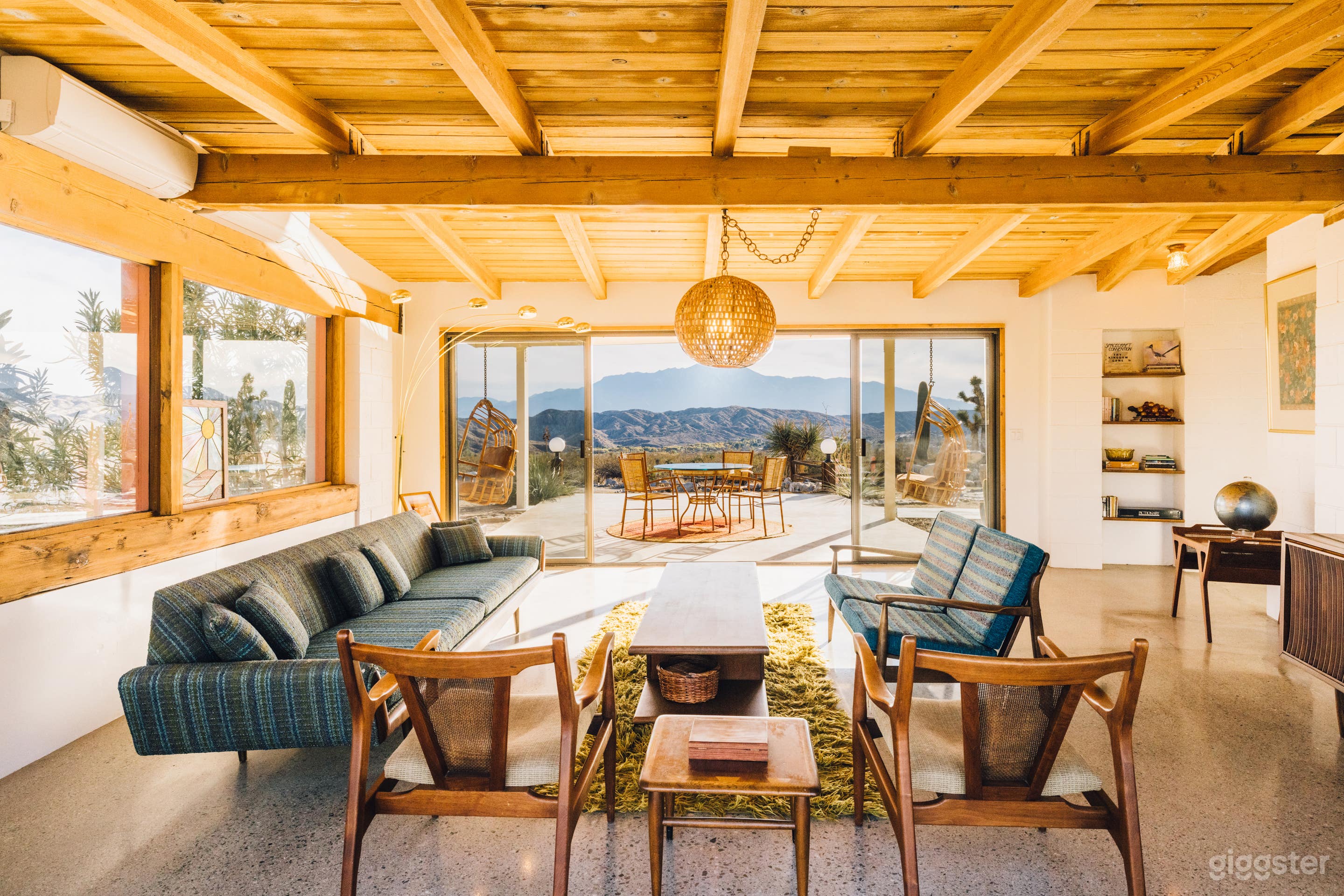 Mid Century Living Room with pass through glass sliders leading to covered patio with Mt. San Jacinto views