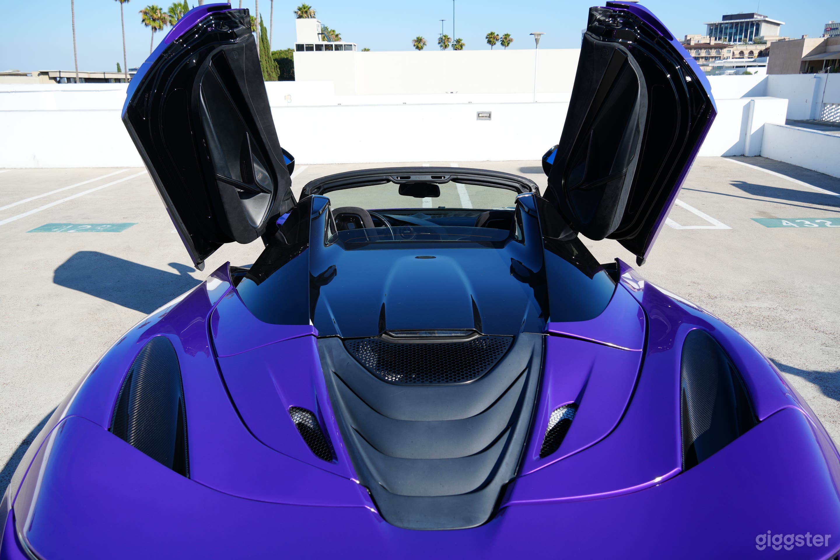 The car's black-painted engine cover and vents