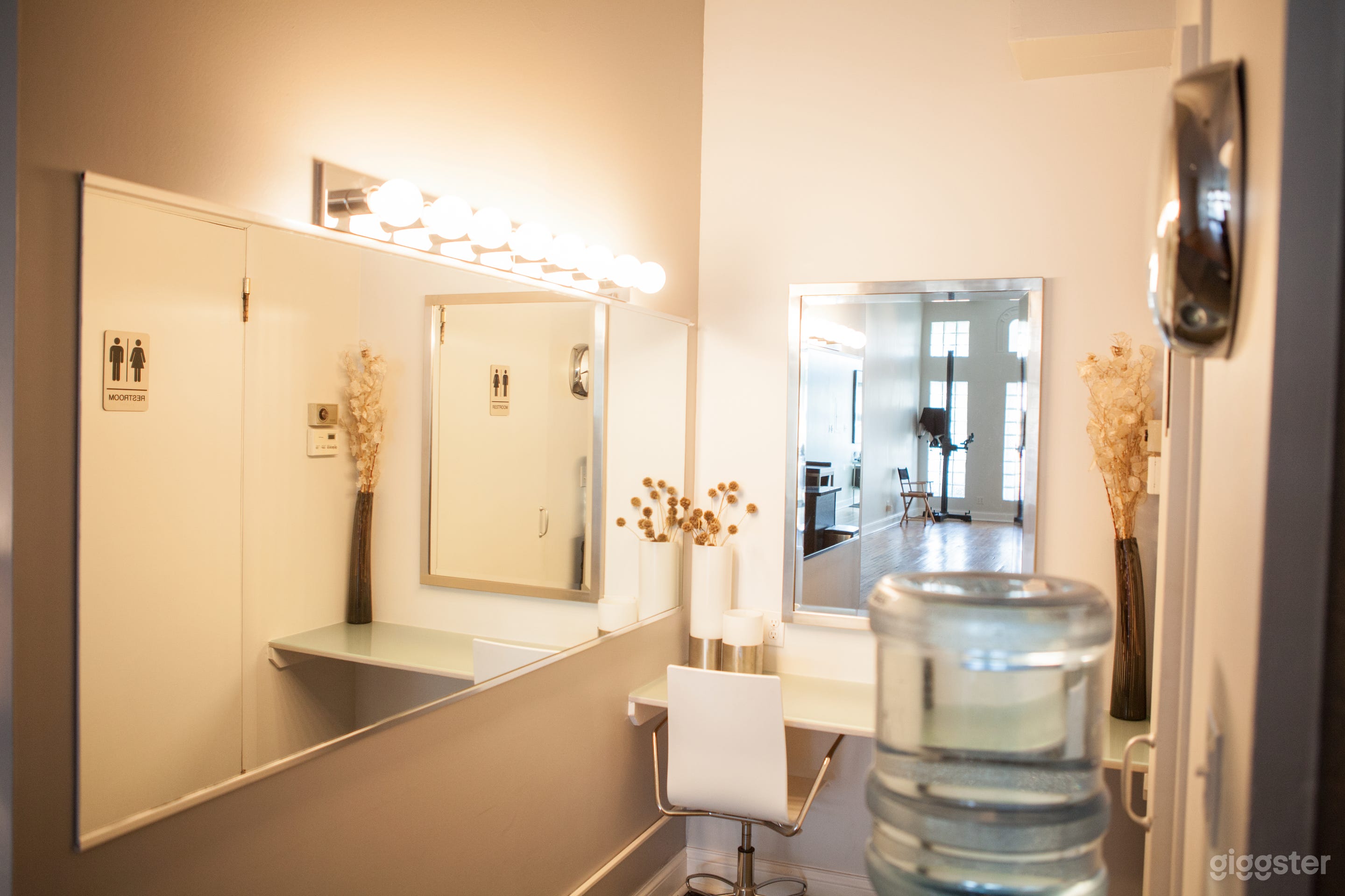 Hair and makeup area. 
Across from the restroom is an alcove set up with a large mirror and vanity lights - perfect for hair and makeup.