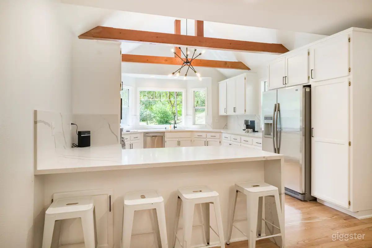 Remodeled Farmhouse kitchen with bay windows, exposed beams, cathedral ceilings and tons of natural light.
