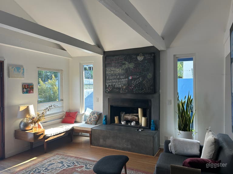  Fireplace and sitting area. Chalkboard hides smart TV. 