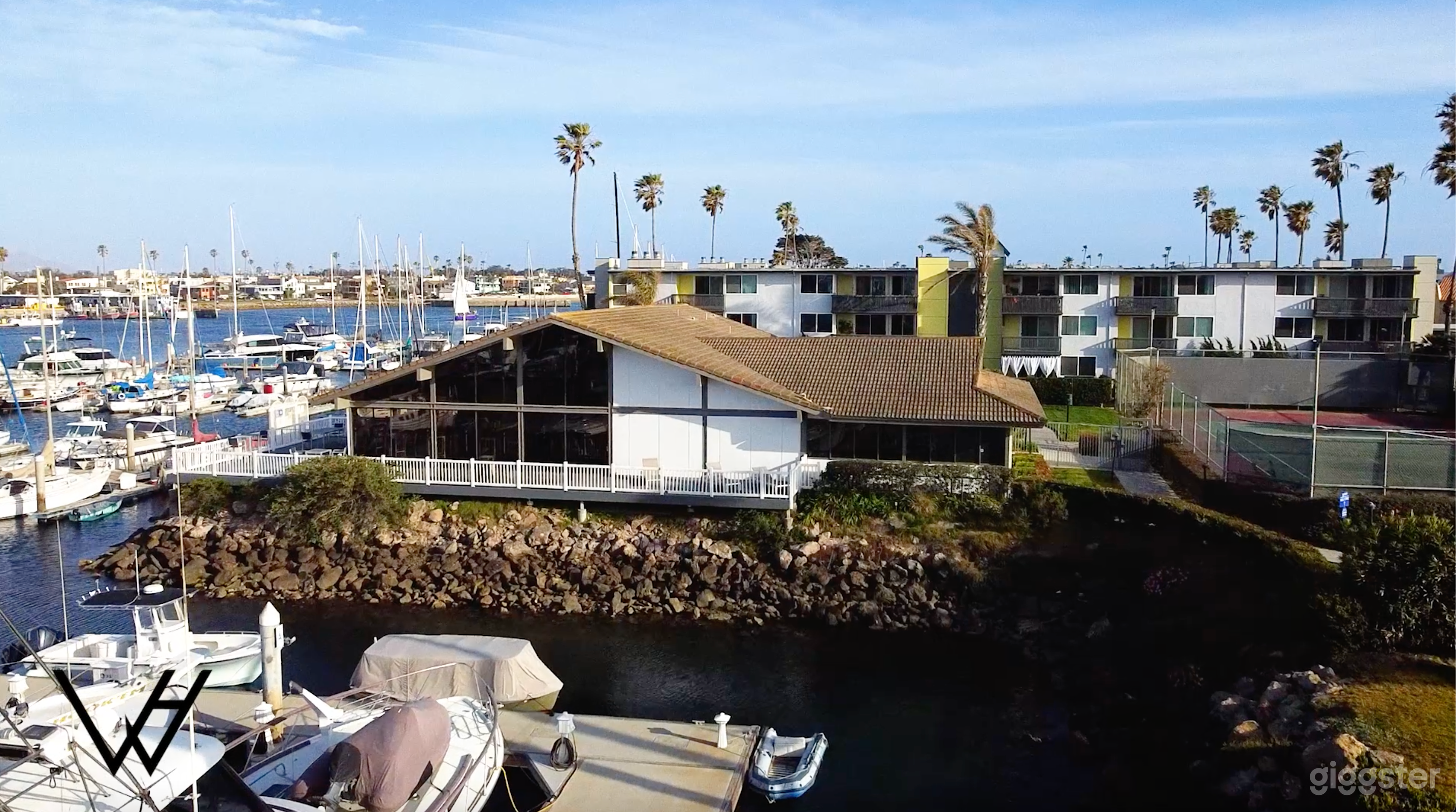 Exterior of the clubhouse and a view of the deck/patio area.
