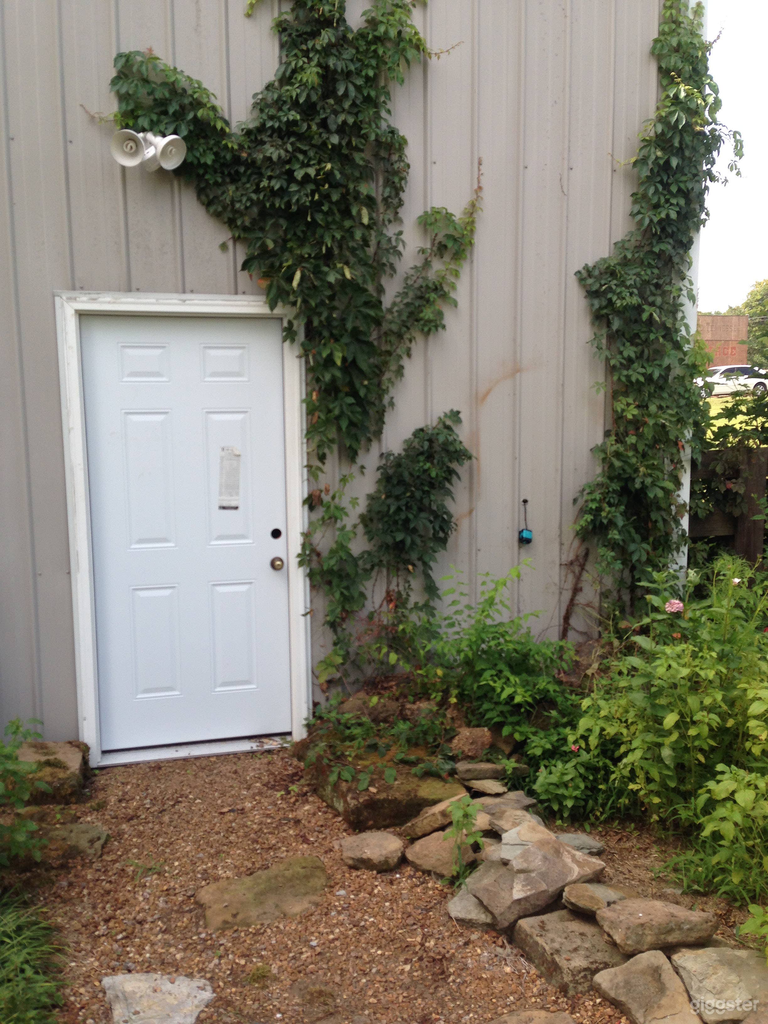 outdoor view from trailer parking area with hookups - this door opens to the studio inside. Wifi available.