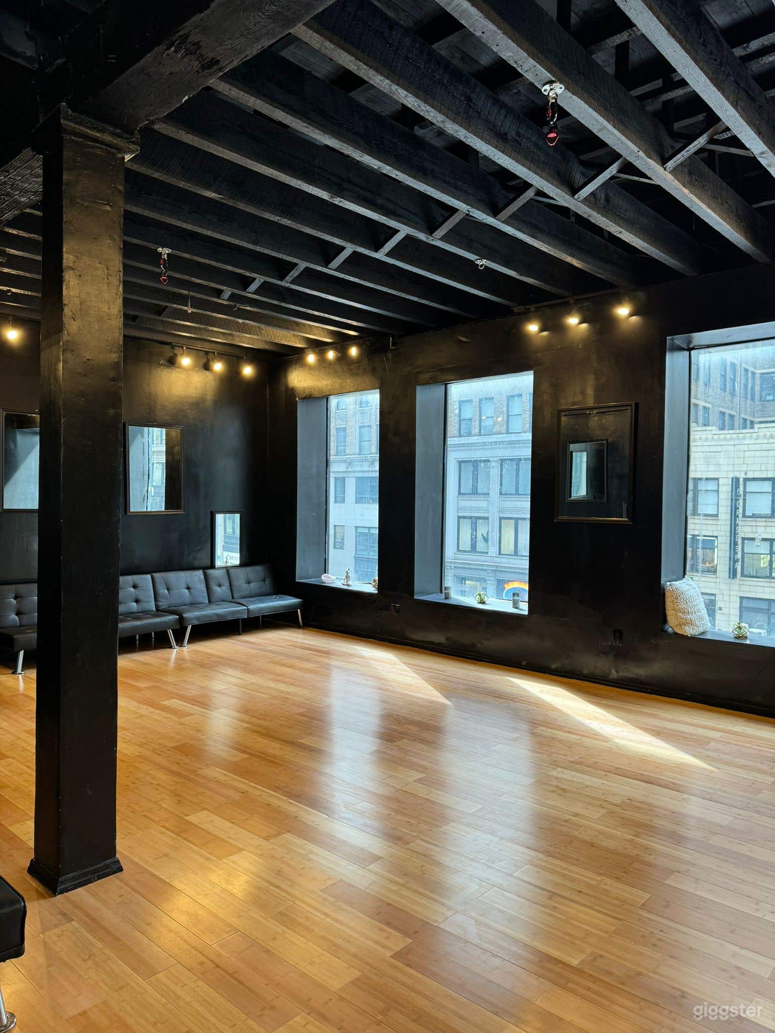 2 rooms combined in one as newly furnished wooden floors and black walls and ceilings. These large windows facing 7th Ave. with views parallel to Madison Square Garden. (Access to rooftop—1 floor up is available)