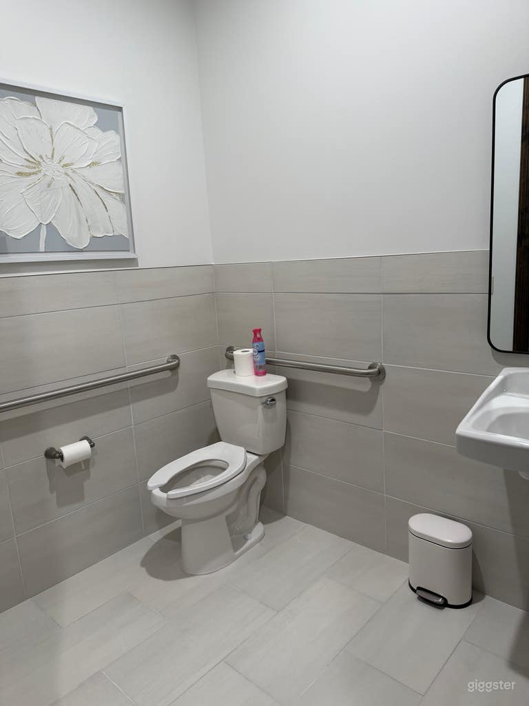  Bathrooms - 4x singular bathrooms equipped with single toilet, sink, mirror, and paper towel dispenser. 