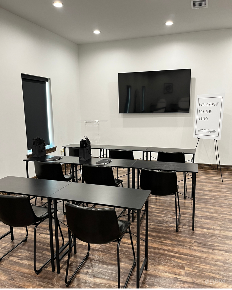  Large Conference Room - 8 individual desks and correlating chairs (Can fit more if provided, ie. table/ chair rental) Acrylic podium included. 65 inch TV with iPad available for mirroring capabilities.  