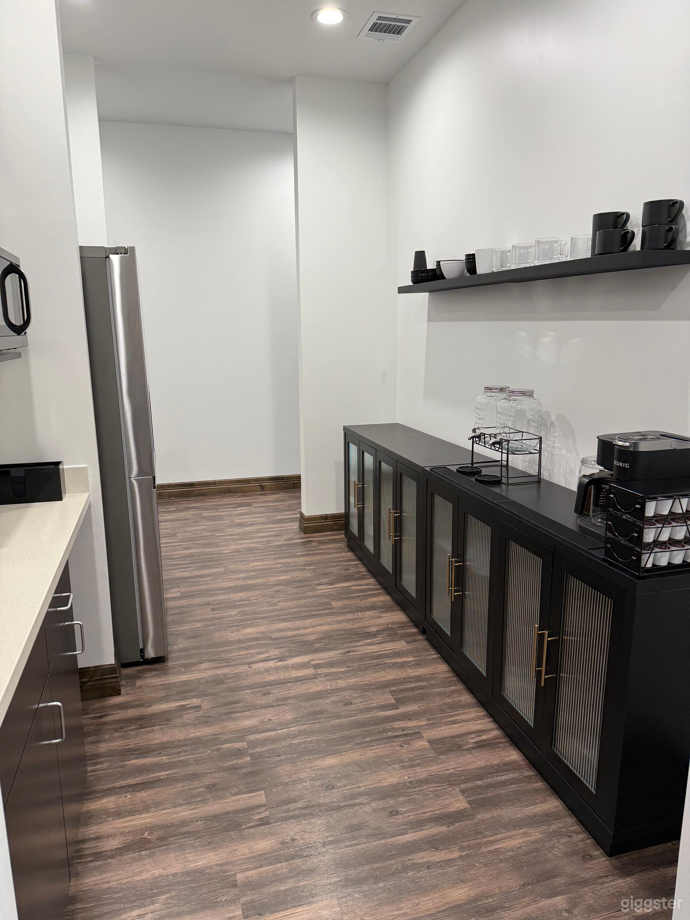 Kitchen - Full size fridge and Microwave. Coffee machine with both pot and Keurig capabilities. Water dispenser. Sink. Dishware and silverware. Kitchen trashcan.