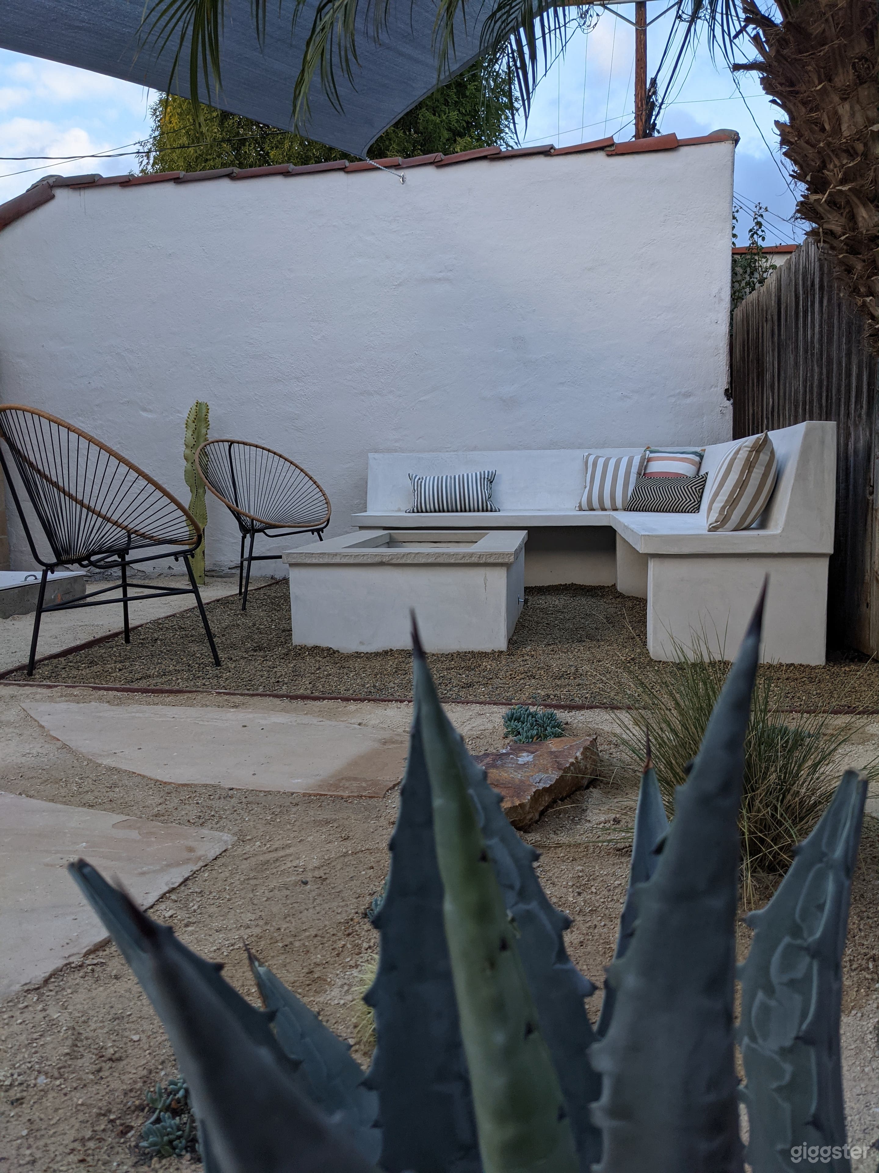 Intimate back yard with outdoor bench (can fit 6-8 people), large, built-in gas fit pit