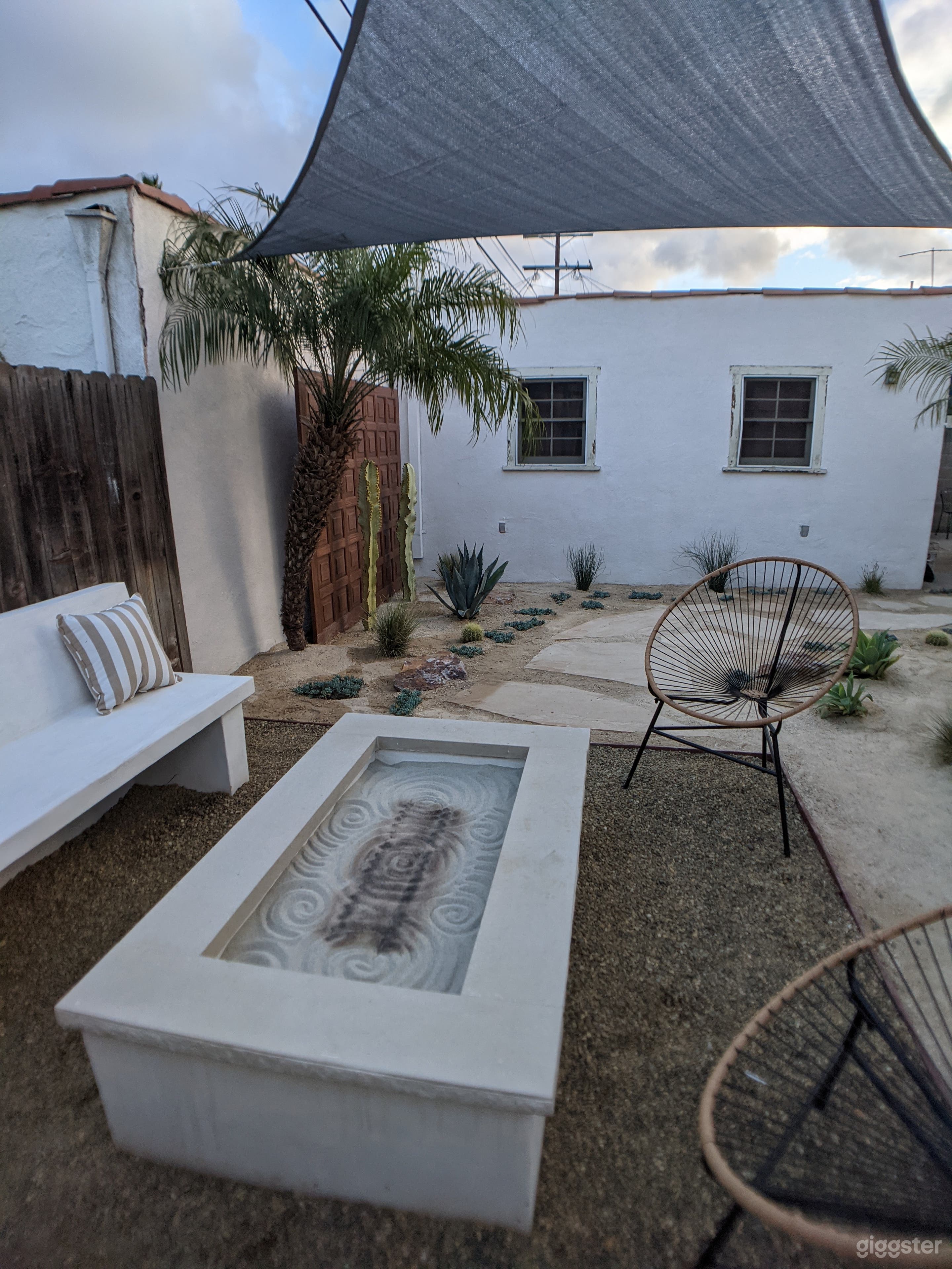 Intimate back yard with outdoor bench (can fit 6-8 people), large, built-in gas fit pit