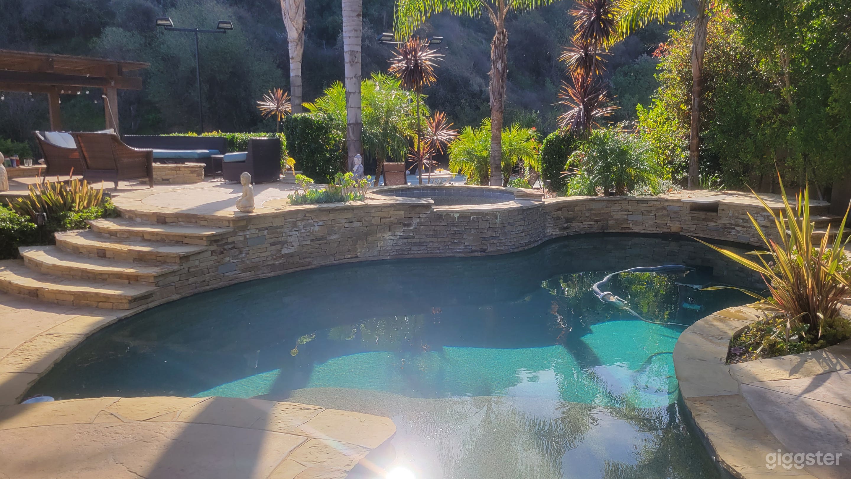 The oasis pool with elevated jacuzzi.