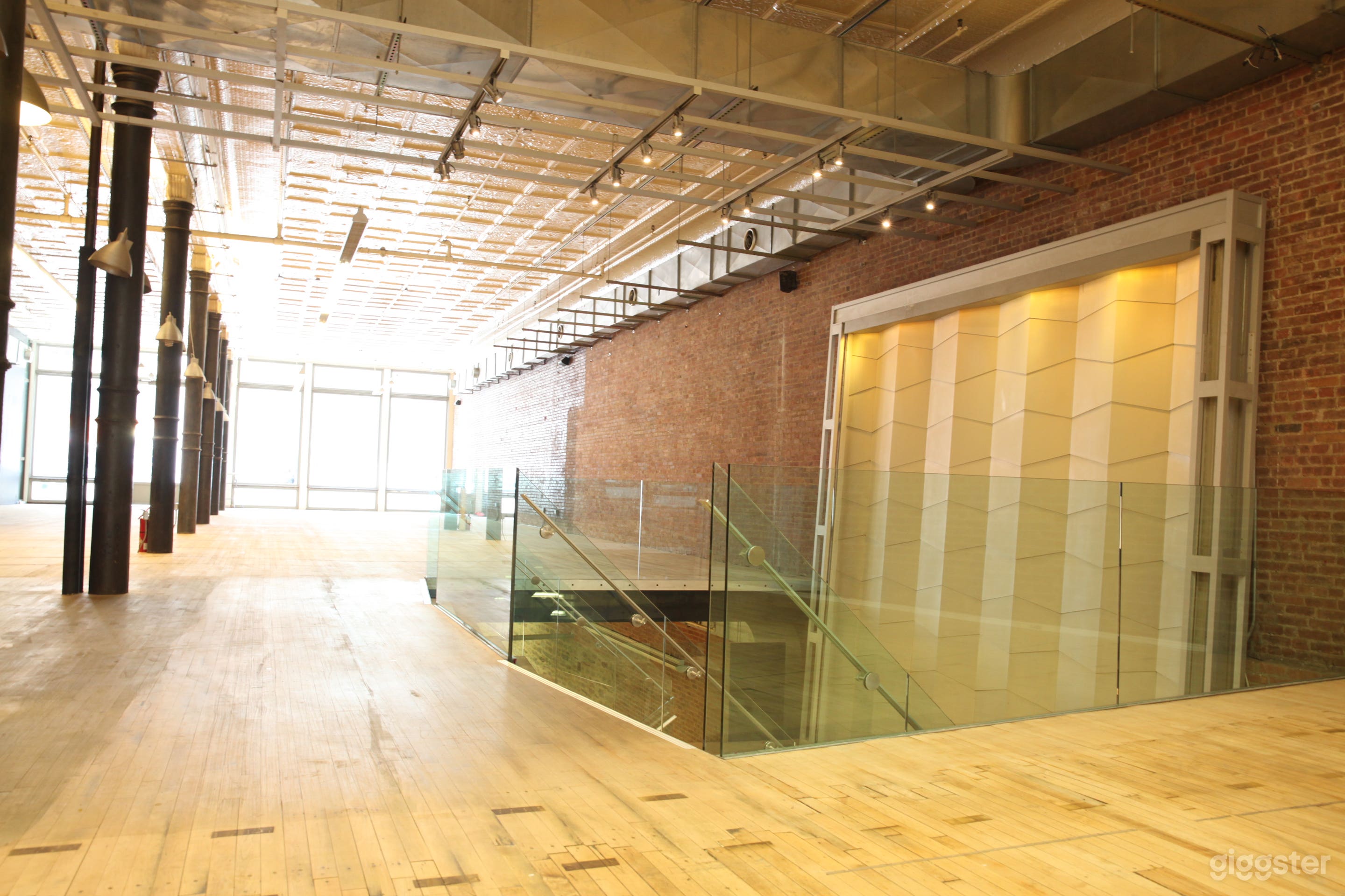 Ground floor facing Broadway. Entrances on both Broadway and Mercer streets. Operating waterfall pictured.