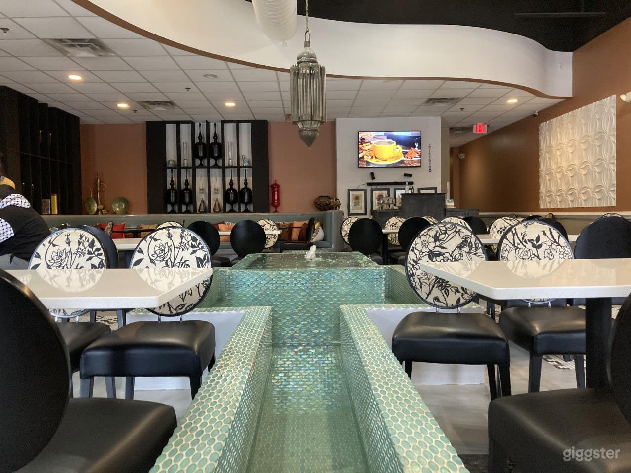 High ceilings, Contemporary Mediterranean / Middle eastern decor. Fountain. 